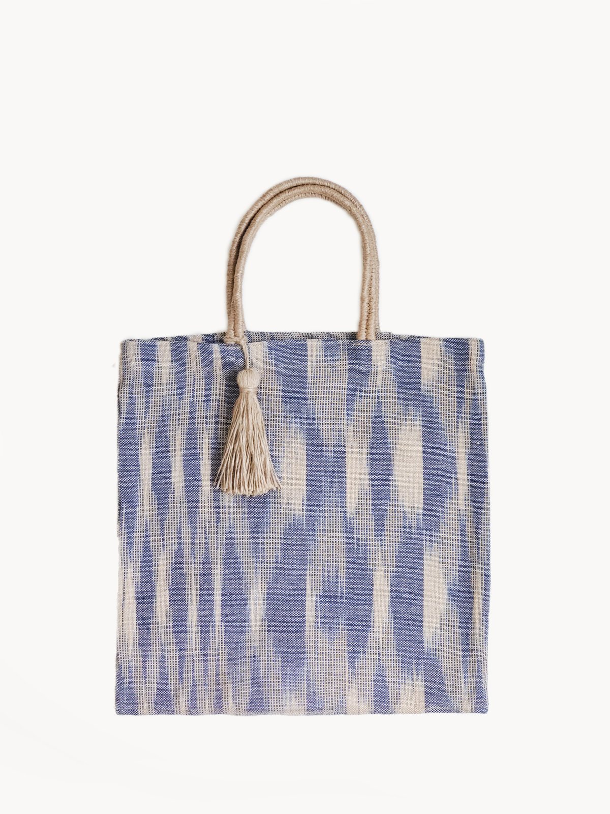 Nadi Jute Tote Bag in Blue, handwoven and naturally dyed, showcasing its spacious design and sturdy handles.