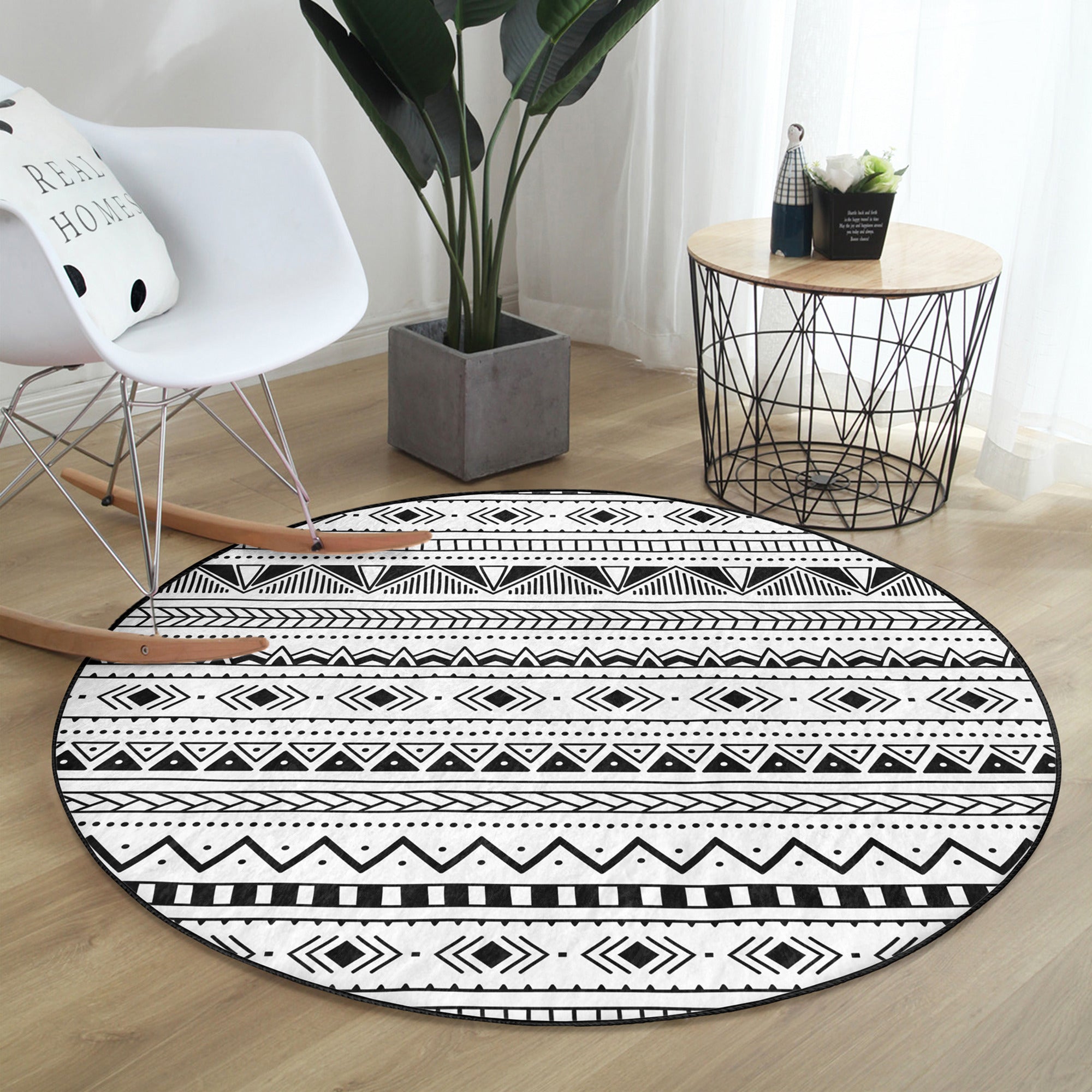 Native Round Rug in black and white, showcasing its soft velvet texture and round shape, perfect for home decor.