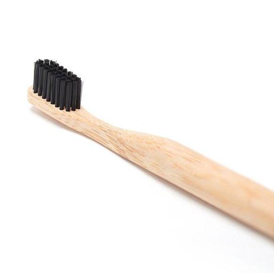 Natural Bamboo Toothbrush with soft bristles and smooth handle, ideal for eco-friendly oral care.