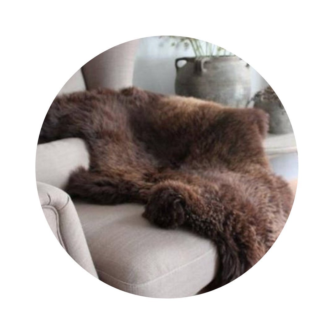 Luxurious Natural Brown Sheepskin rug with long, soft hair, showcasing its unique texture and rich color.