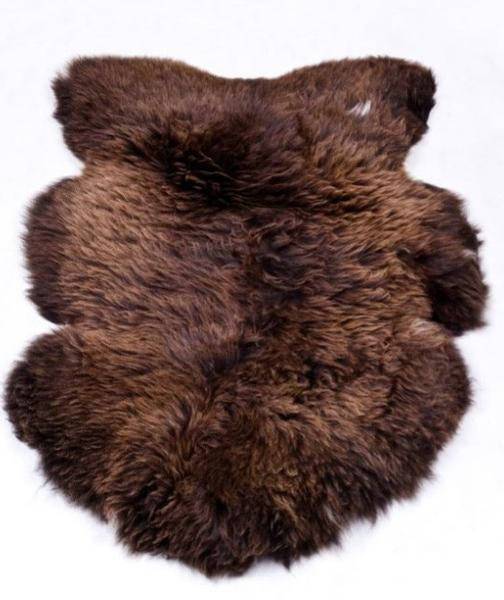 Luxurious Natural Brown Sheepskin rug with long, soft hair, showcasing its unique texture and rich color.