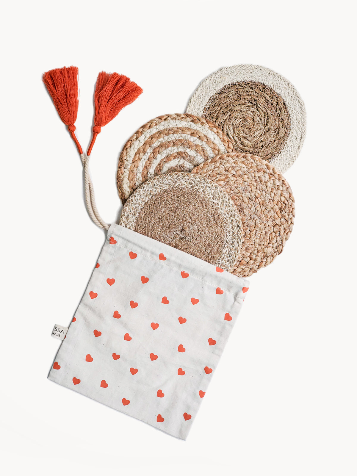 Natural Coaster Trivet Gift Set featuring four handmade coasters made from jute and seagrass, displayed with a heart-shaped drawstring pouch.