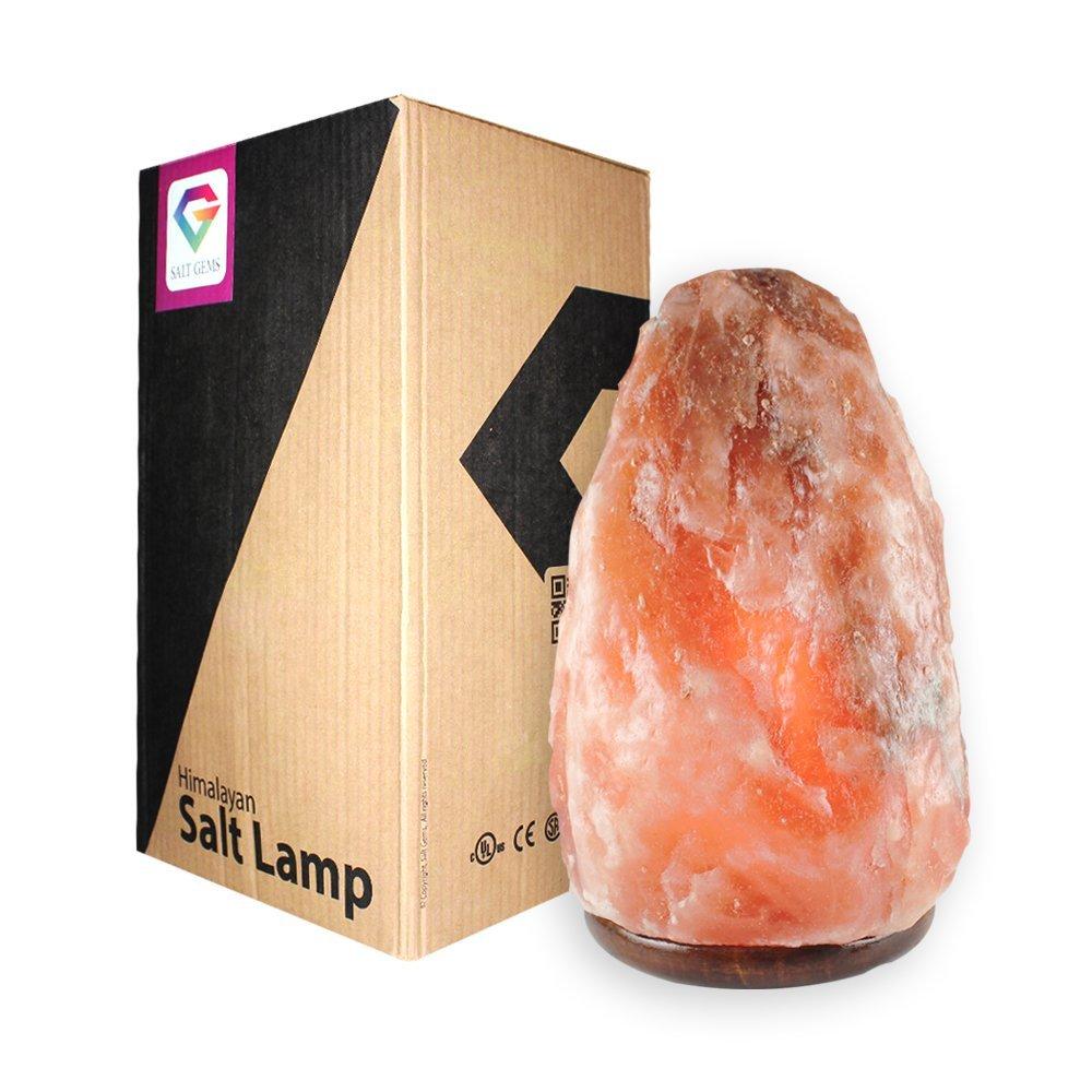 Natural Himalayan Salt Lamp Air Purifier with a warm amber glow, hand-carved from Himalayan salt, mounted on a polished wooden base, showcasing unique shapes and colors.