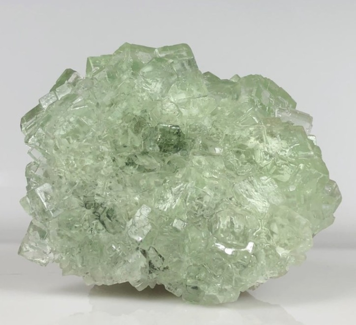 Natural Raw Green Fluorite Crystal weighing 5 lbs, showcasing its unique cubic and octahedral formations in vibrant green hues.