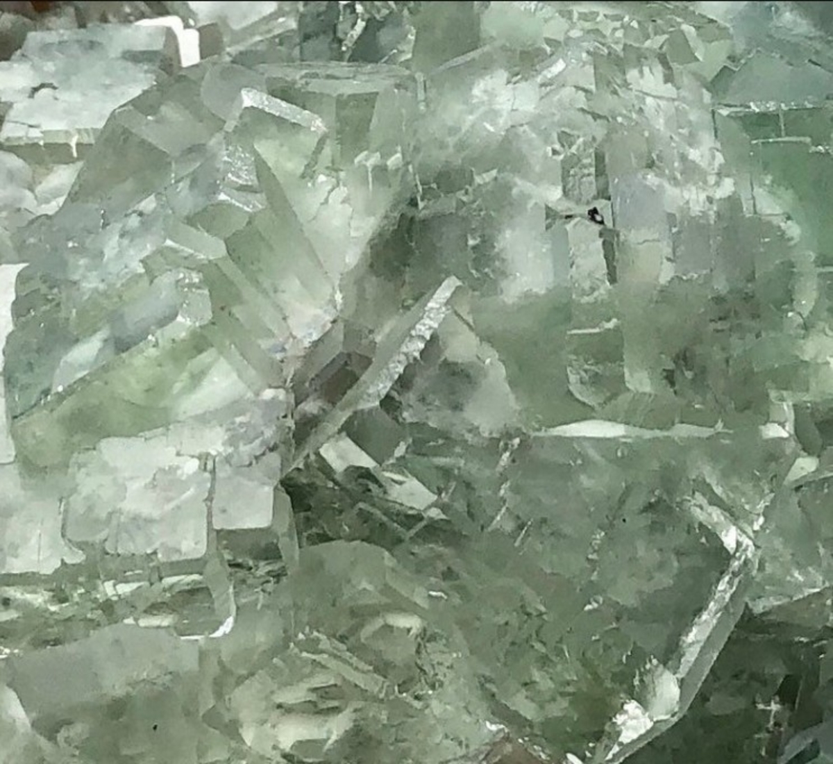 Natural Raw Green Fluorite Crystal weighing 5 lbs, showcasing its unique cubic and octahedral formations in vibrant green hues.