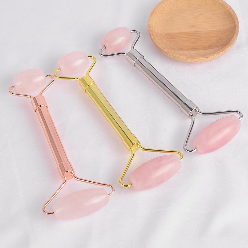 Natural Rose Quartz Face Massage Roller with a metal handle, designed for anti-aging and relaxation, showcasing its elegant pink color.