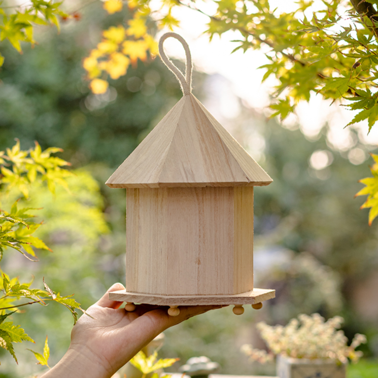 Natural Solid Wood Bird's Nest made from Paulownia wood with hemp rope, showcasing rustic charm and eco-friendly design.