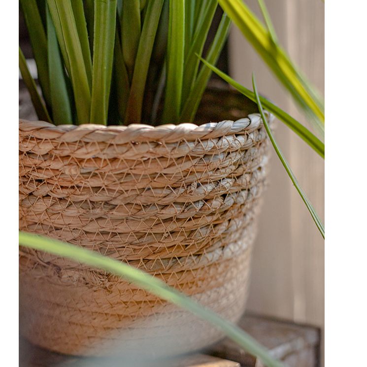 Natural Straw Desktop Flower Basket in khaki/brown color, showcasing its round shape and woven texture, ideal for flowers or desk organization.