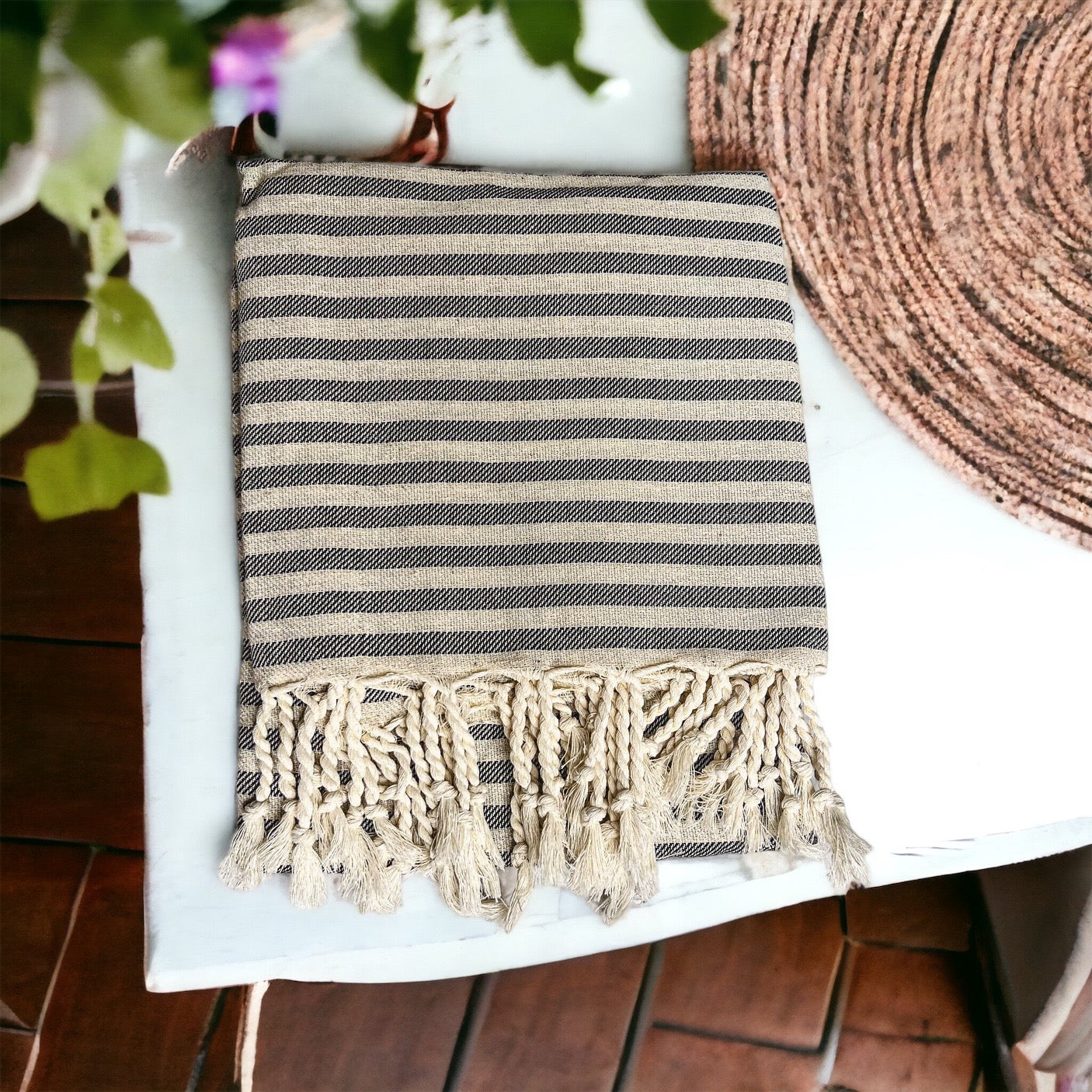 Nautical Towel 180GSM made from 100% Turkish cotton, featuring blue and grey stripes with decorative tassels.