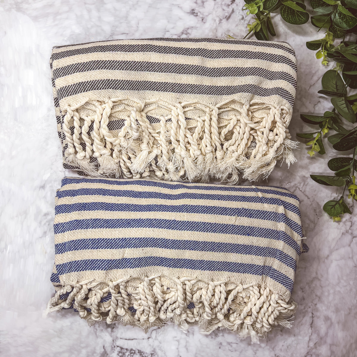 Nautical Towel 180GSM made from 100% Turkish cotton, featuring blue and grey stripes with decorative tassels.