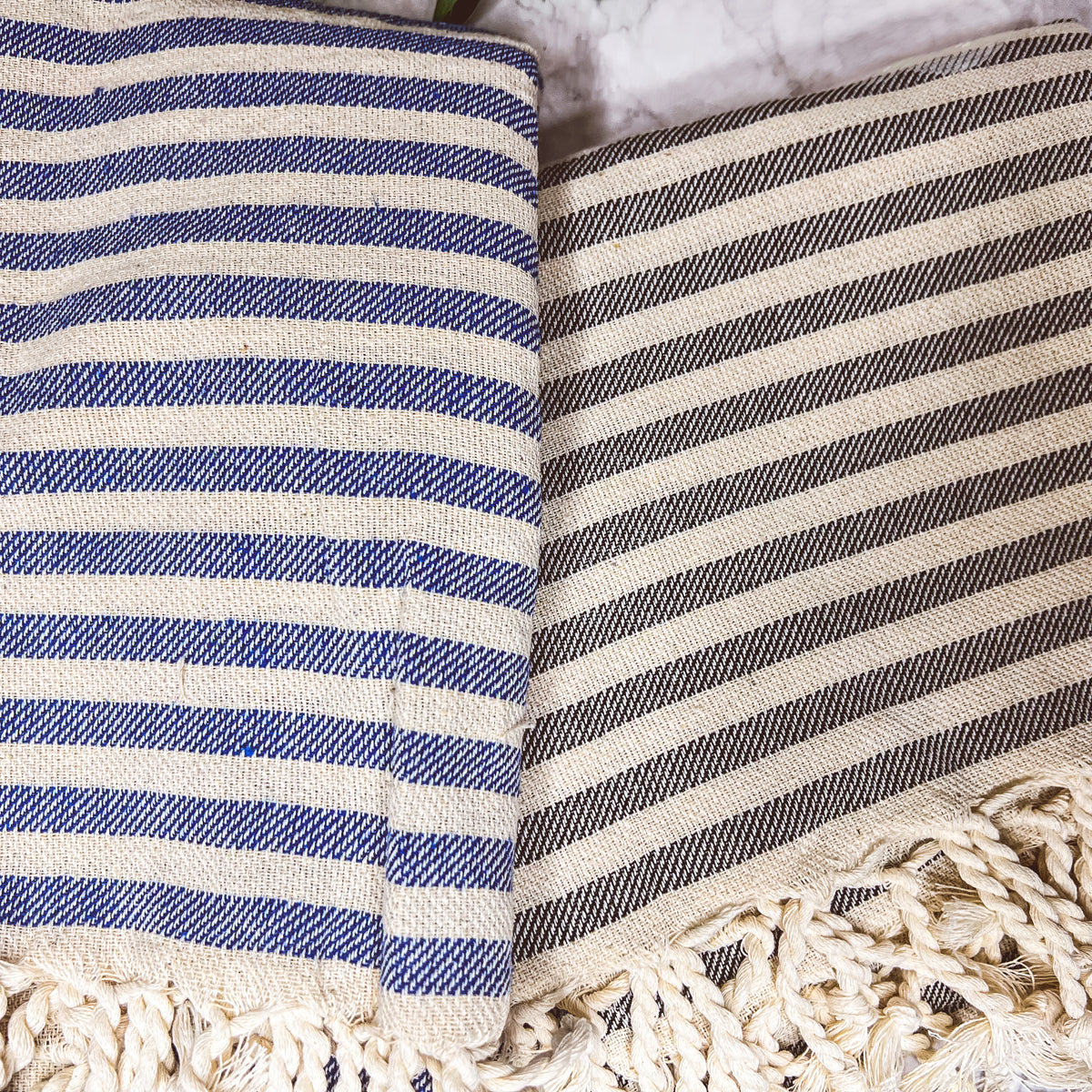 Nautical Towel 180GSM made from 100% Turkish cotton, featuring blue and grey stripes with decorative tassels.