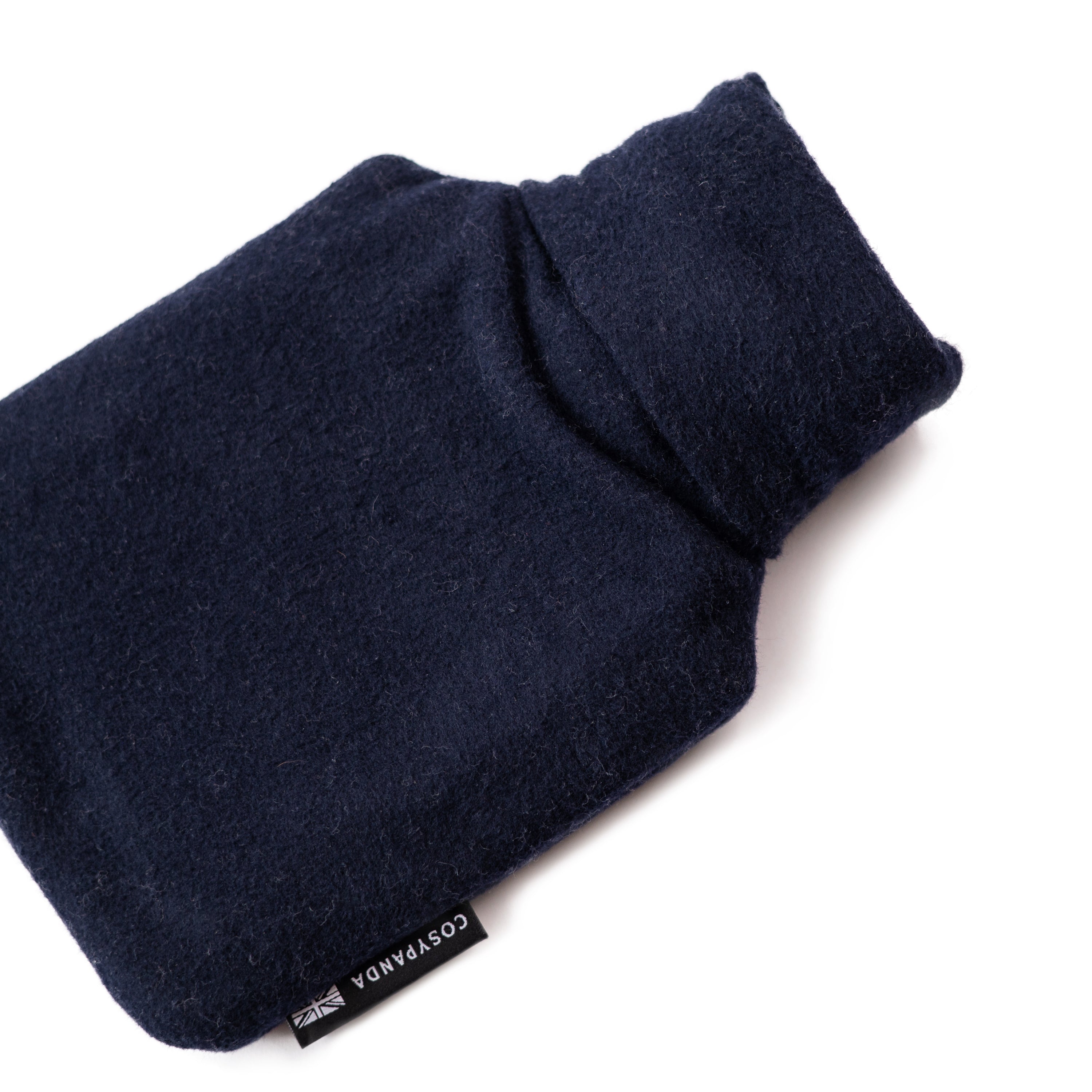 Navy blue cotton hot water bottle with a natural rubber bottle inside, showcasing its eco-friendly design and handmade quality.