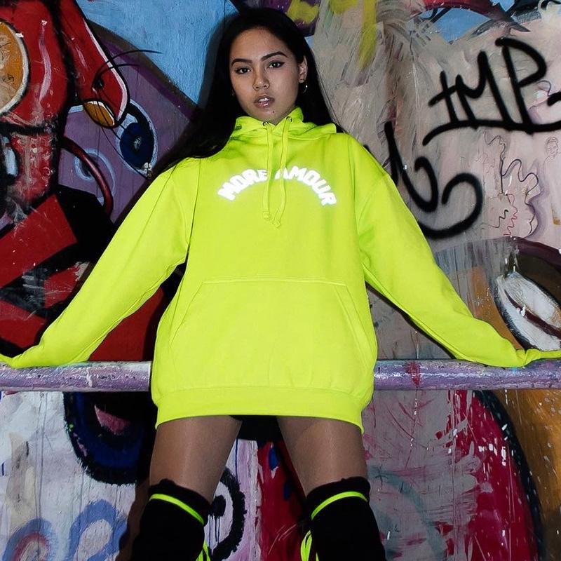 A stylish neon reflective letter print hoodie for women, featuring long sleeves and a comfortable fit, perfect for autumn and winter wear.