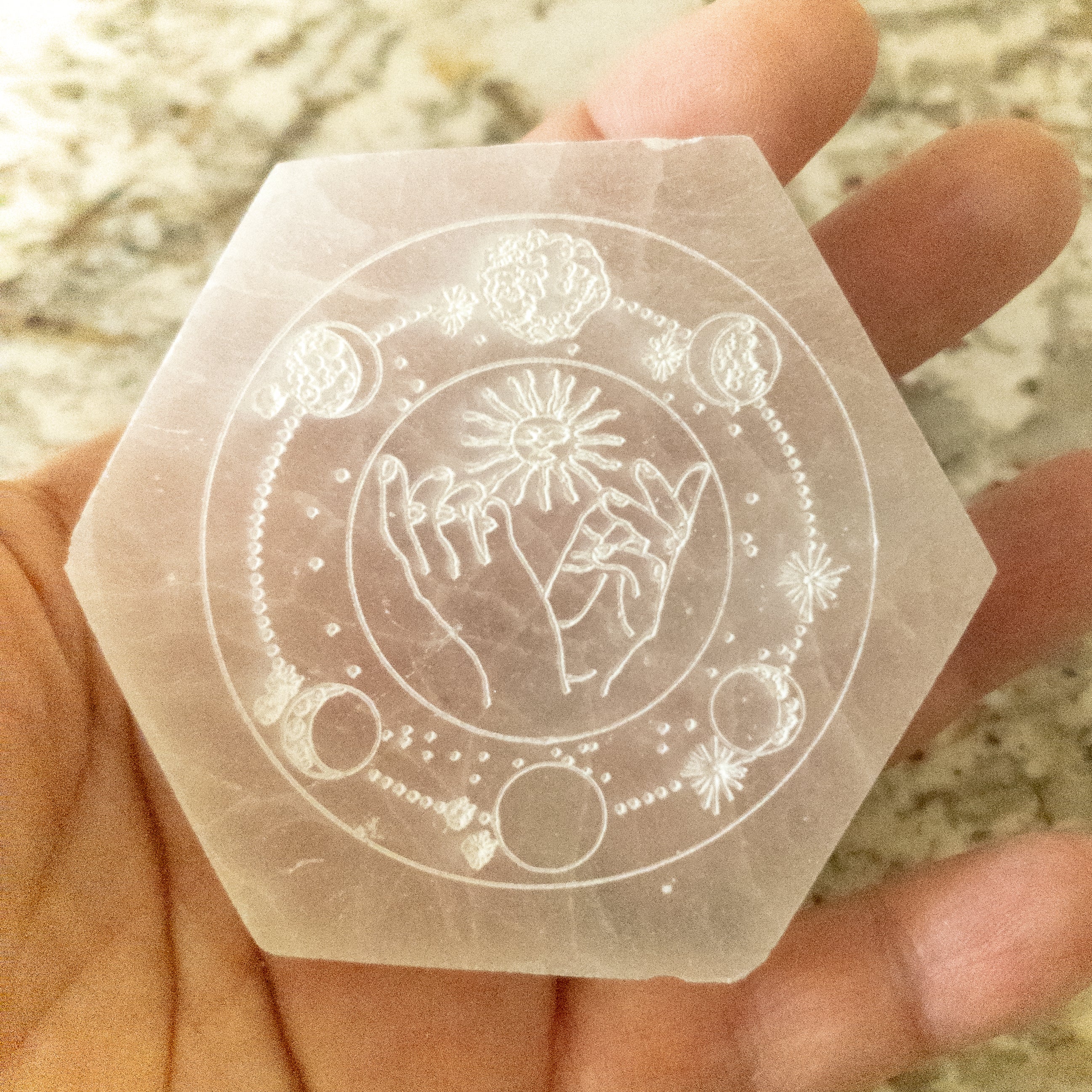 NEW Celestial Engraved Selenite Hexagon Plate featuring sun and moon designs, perfect for crystal recharging and home decor.