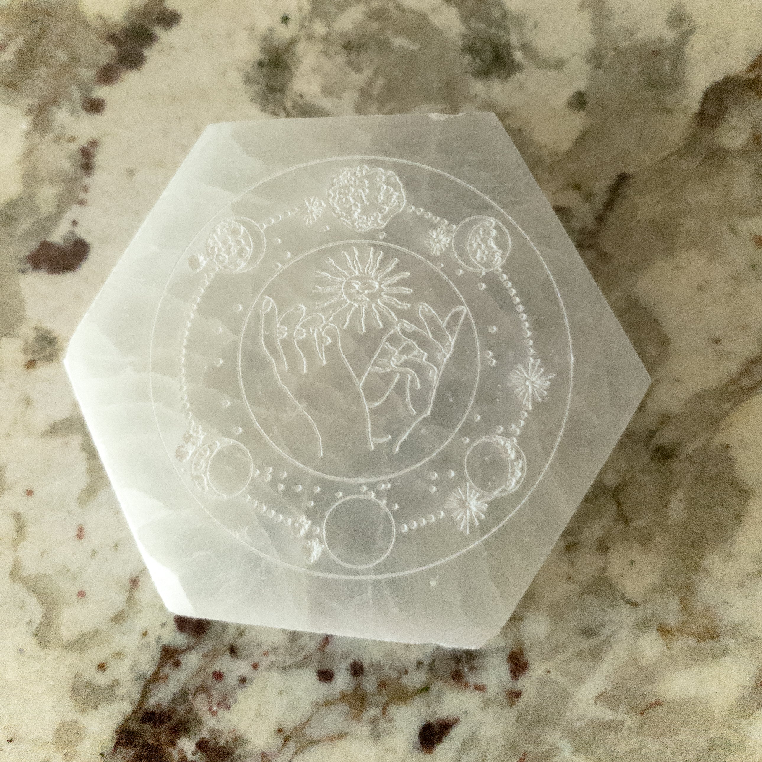 NEW Celestial Engraved Selenite Hexagon Plate featuring sun and moon designs, perfect for crystal recharging and home decor.