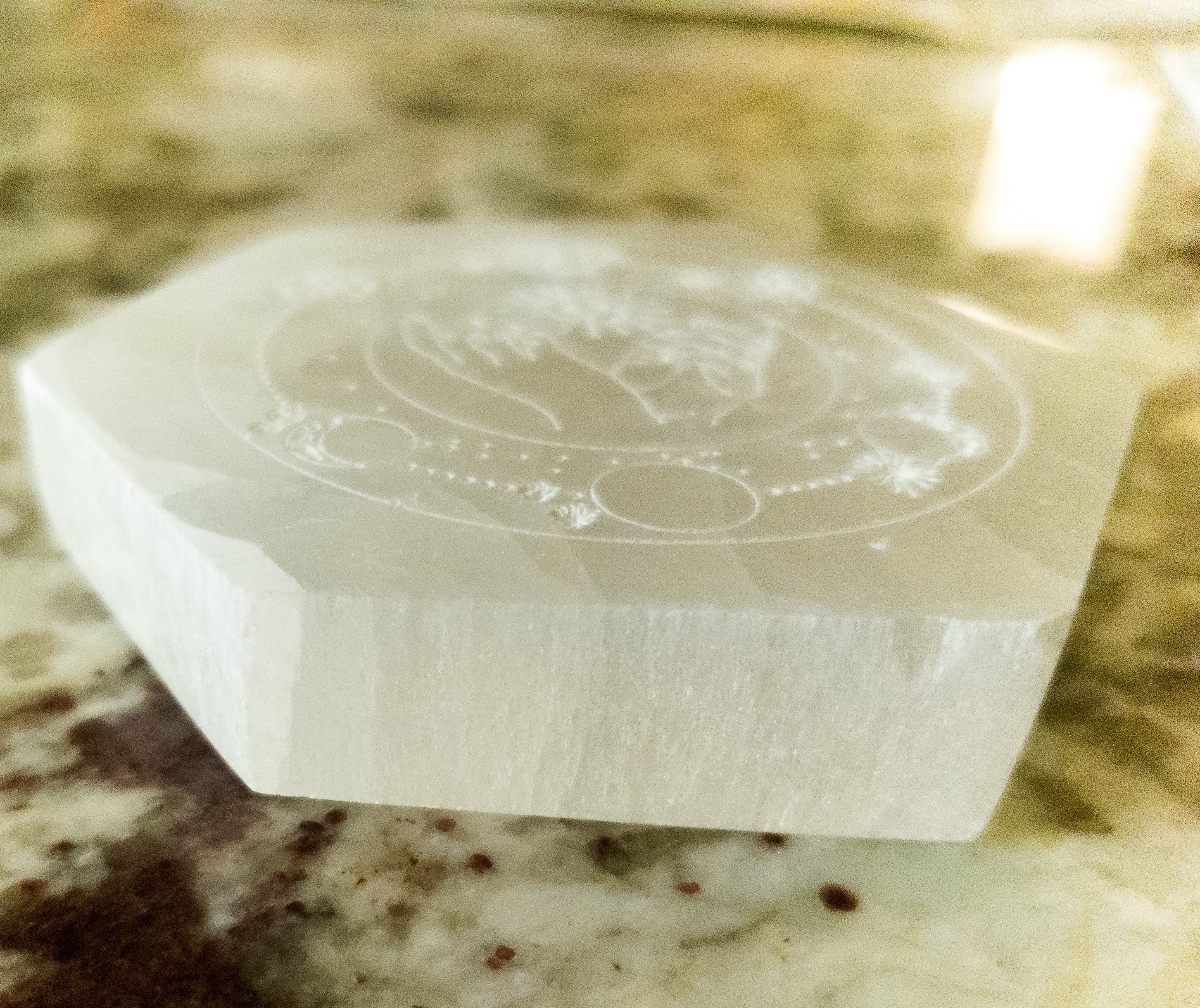 NEW Celestial Engraved Selenite Hexagon Plate featuring sun and moon designs, perfect for crystal recharging and home decor.