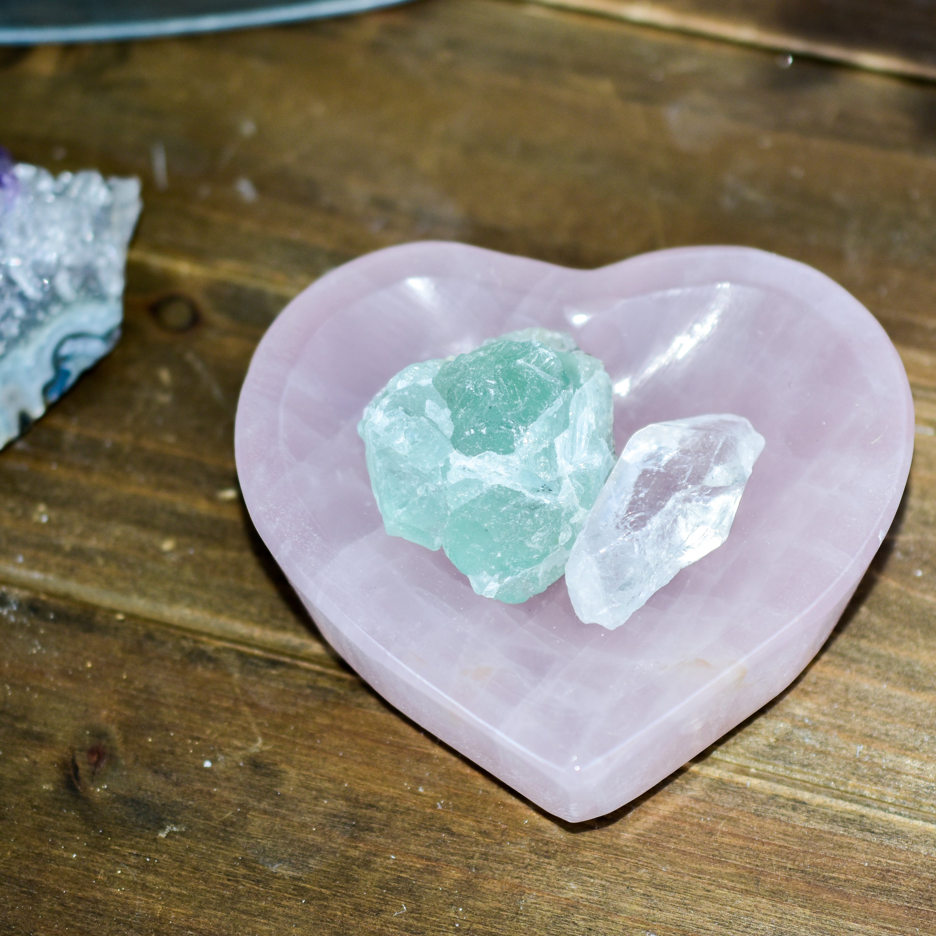 A collection of NEW Crystal Shape Bowls in unique designs including moons, hearts, and cat heads made from Rose Quartz and Quartz.