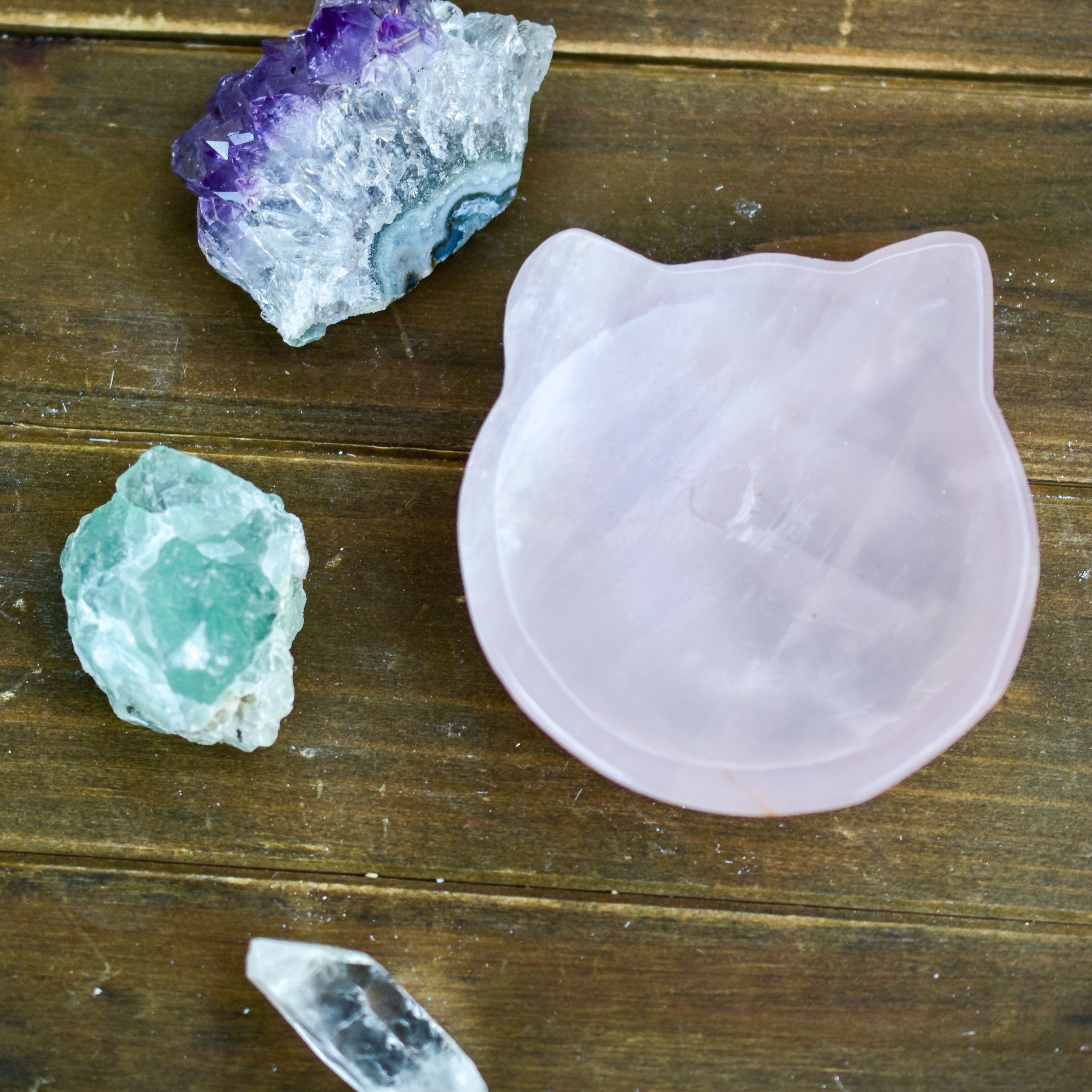 A collection of NEW Crystal Shape Bowls in unique designs including moons, hearts, and cat heads made from Rose Quartz and Quartz.