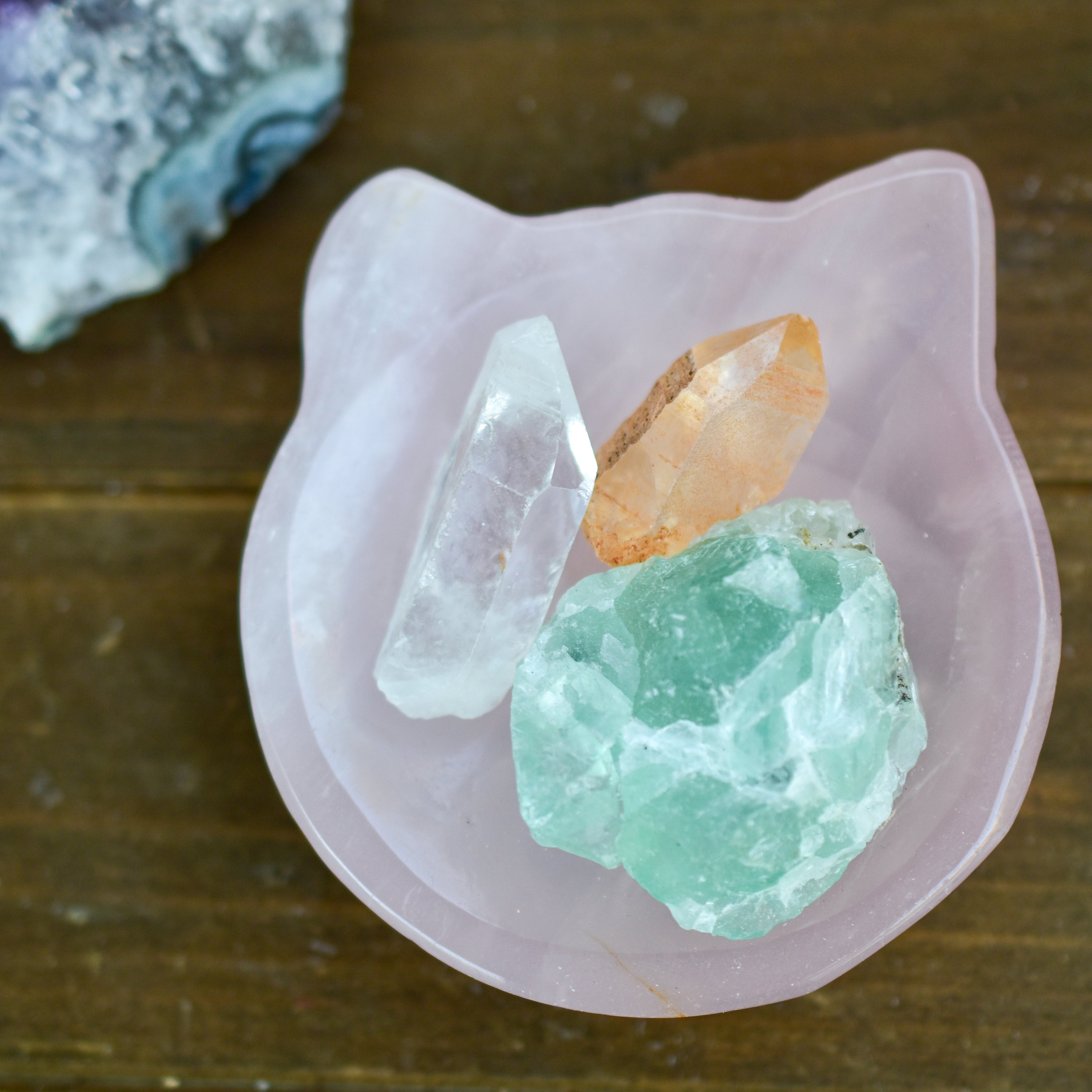 A collection of NEW Crystal Shape Bowls in unique designs including moons, hearts, and cat heads made from Rose Quartz and Quartz.