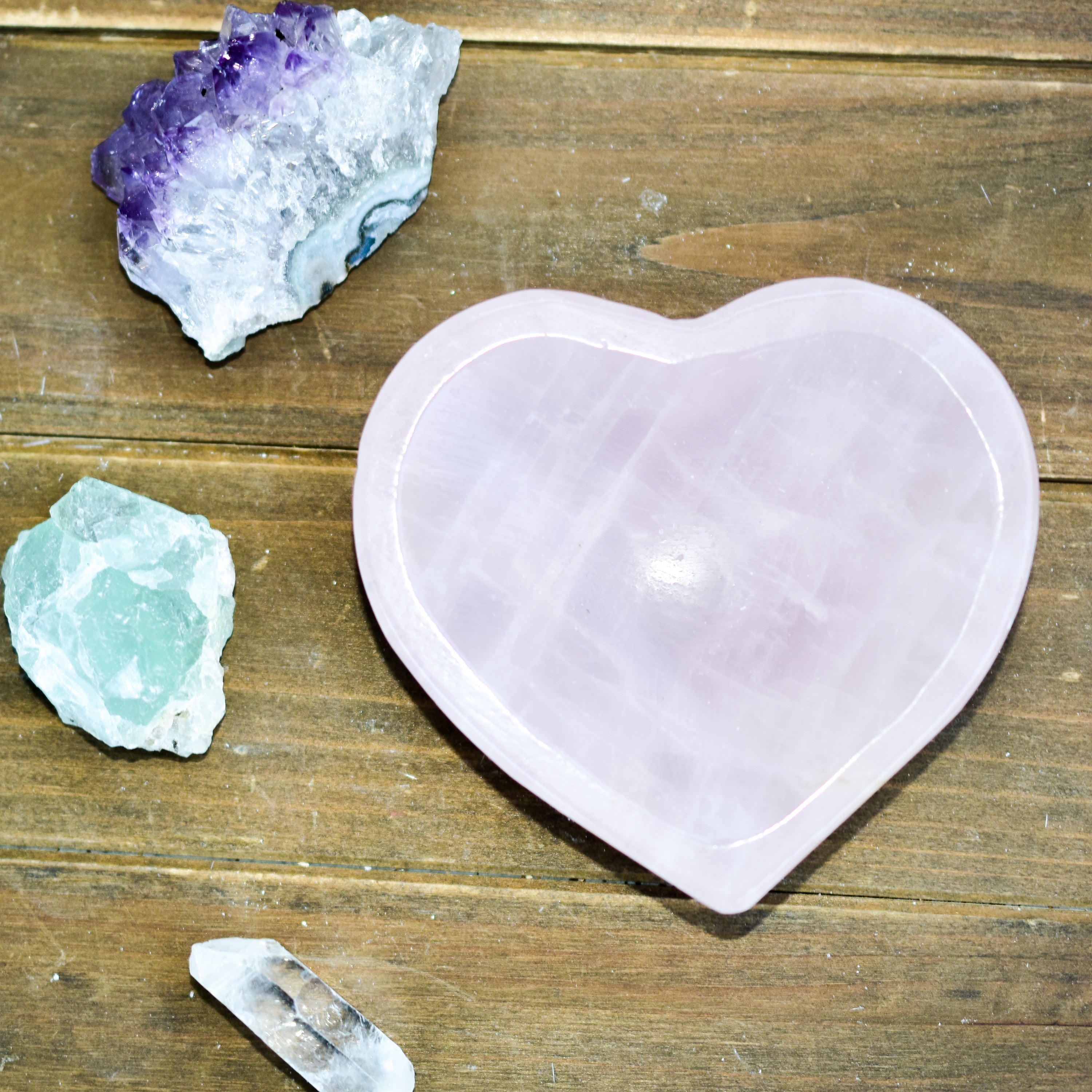 A collection of NEW Crystal Shape Bowls in unique designs including moons, hearts, and cat heads made from Rose Quartz and Quartz.