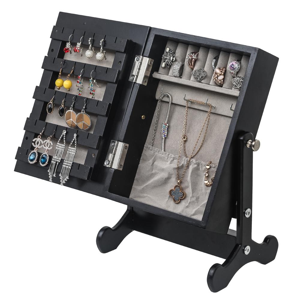 A stylish black desktop makeup mirror jewelry storage cabinet with compartments for organized jewelry storage.