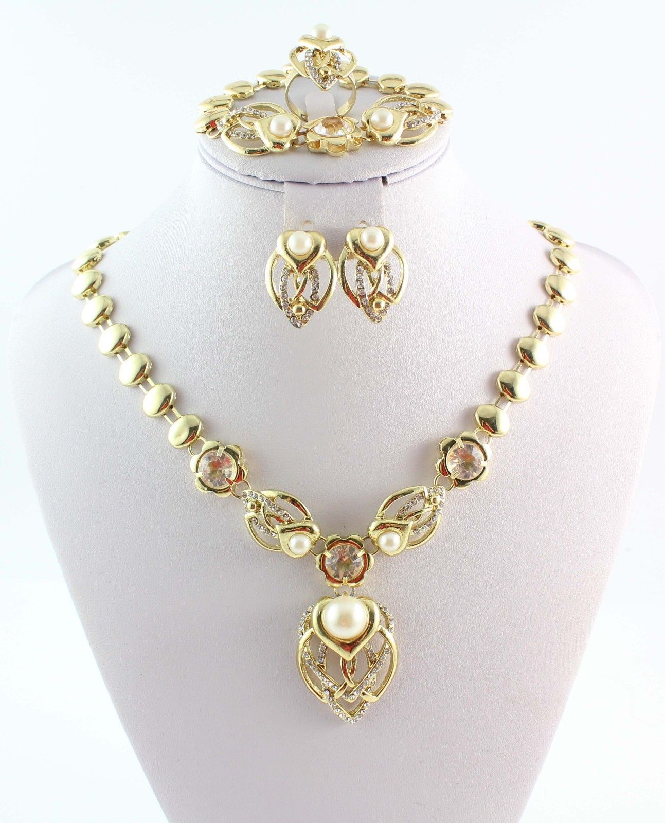 New Fashion African Costume Jewelry Set featuring gold plated necklace, bracelet, earrings, and adjustable ring, elegantly displayed.