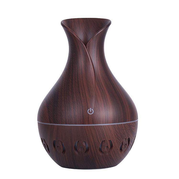 New Hollow-out Wood Grain Mini Ultrasonic Humidifier in dark brown color, featuring a vase design and color-changing LED lights.