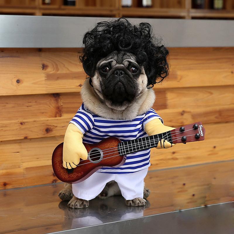 A playful pet dog wearing a funny guitar costume, showcasing a vibrant blue color and a guitar pattern, perfect for festive occasions.