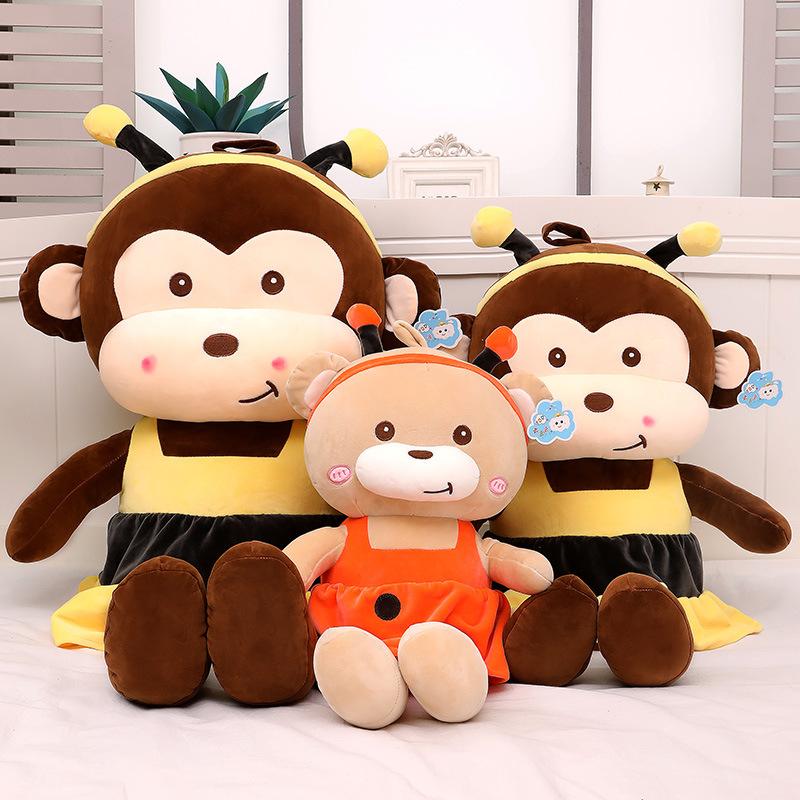 A collection of adorable plush toys including a Kawaii monkey, bear, and bee, showcasing their soft textures and vibrant colors.