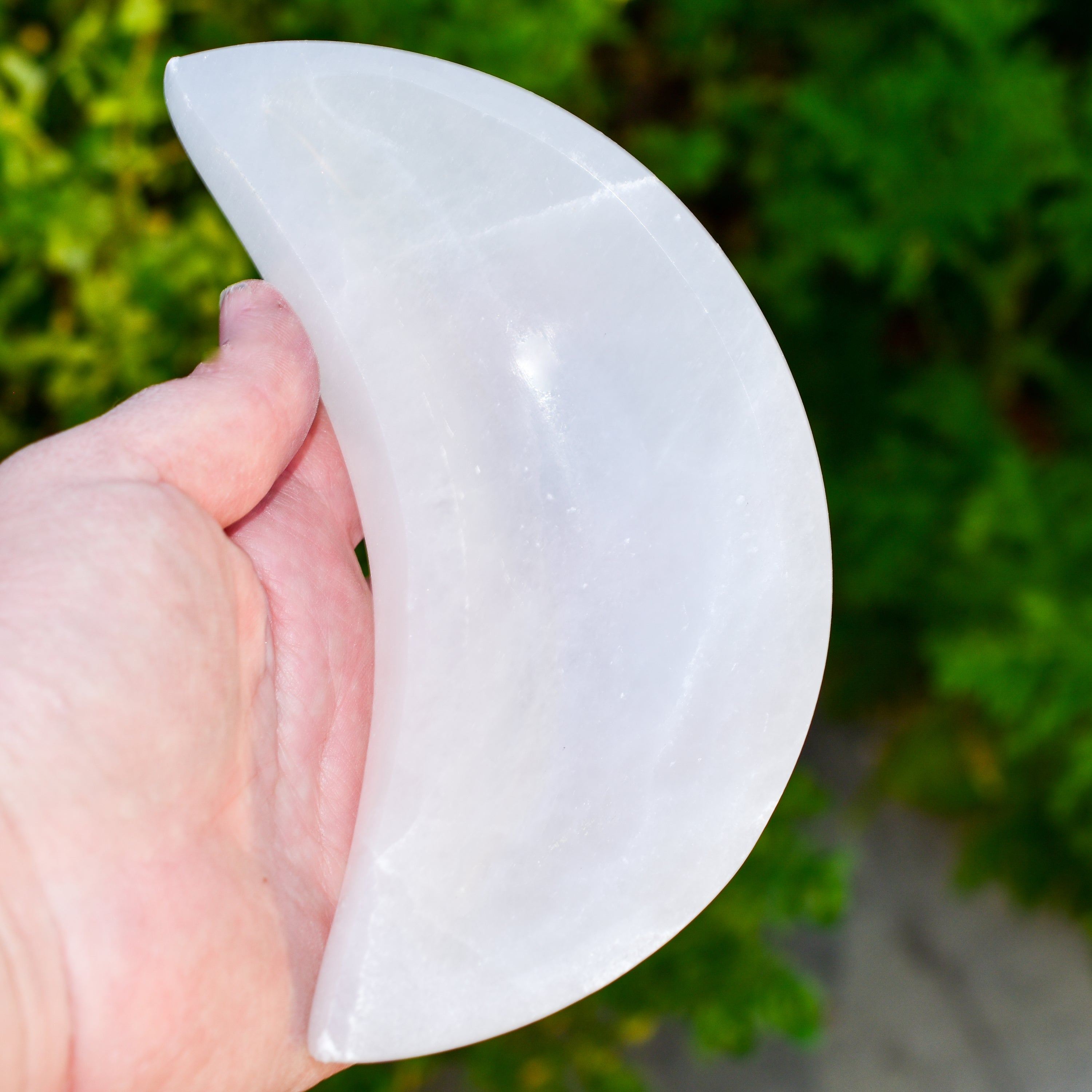 Handmade Selenite Moon Bowl from Morocco, perfect for holding crystals and jewelry.