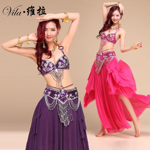 A vibrant New Style Belly Dance Costume featuring a bra, belt, and skirt, adorned with handmade beaded details, available in multiple colors.