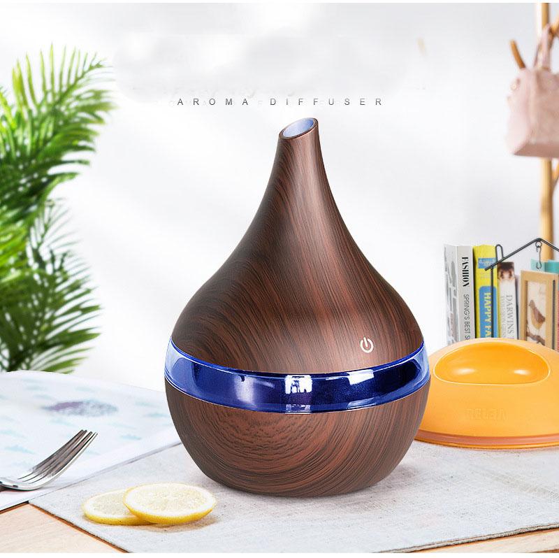 New USB Electric Aroma Diffuser in wood finish, showcasing its elegant design and functionality for essential oil diffusion.