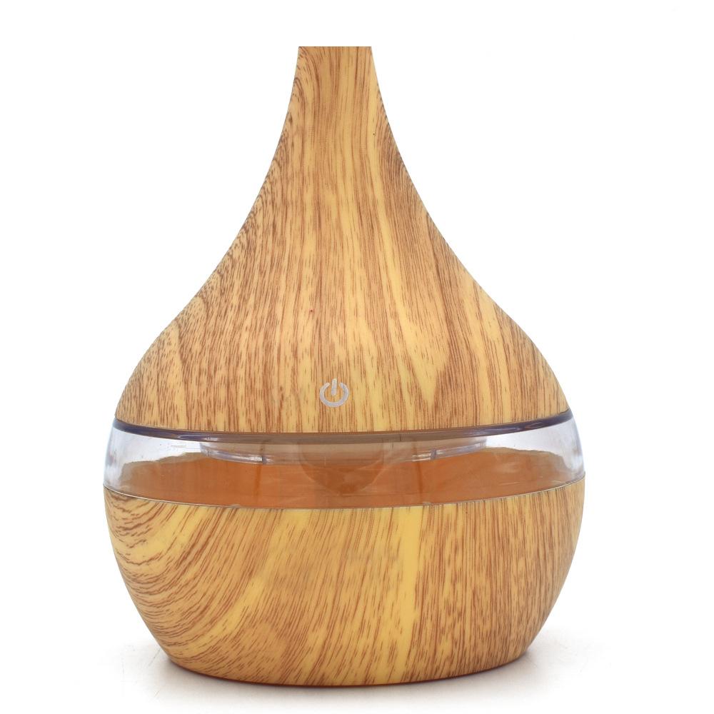 New USB Electric Aroma Diffuser in wood finish, showcasing its elegant design and functionality for essential oil diffusion.