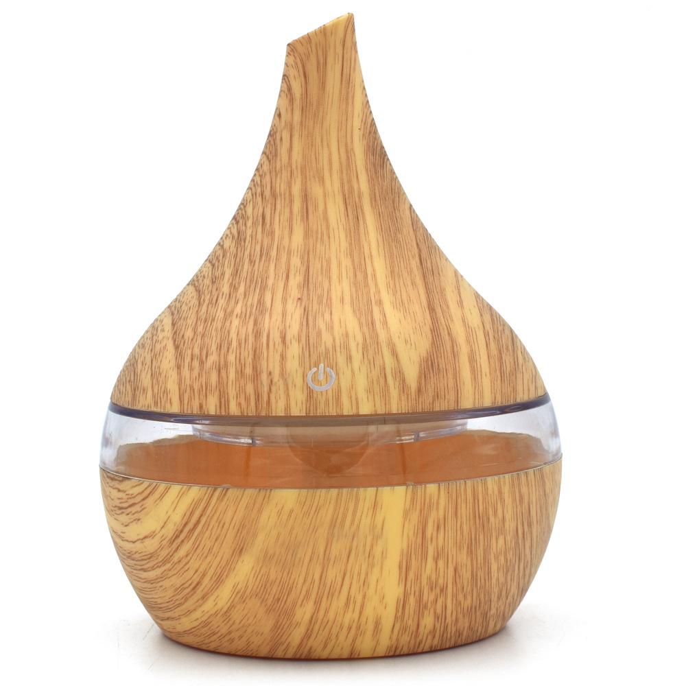 New USB Electric Aroma Diffuser in wood finish, showcasing its elegant design and functionality for essential oil diffusion.