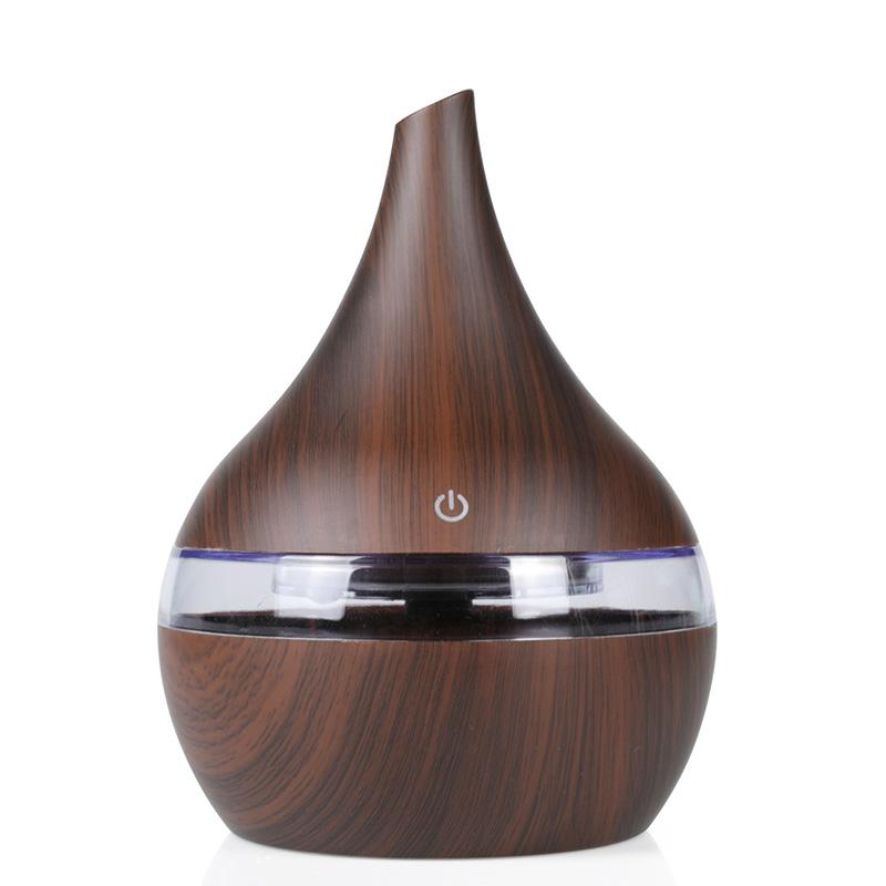 New USB Electric Aroma Diffuser in wood finish, showcasing its elegant design and functionality for essential oil diffusion.