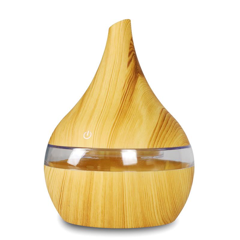 New USB Electric Aroma Diffuser in wood finish, showcasing its elegant design and functionality for essential oil diffusion.