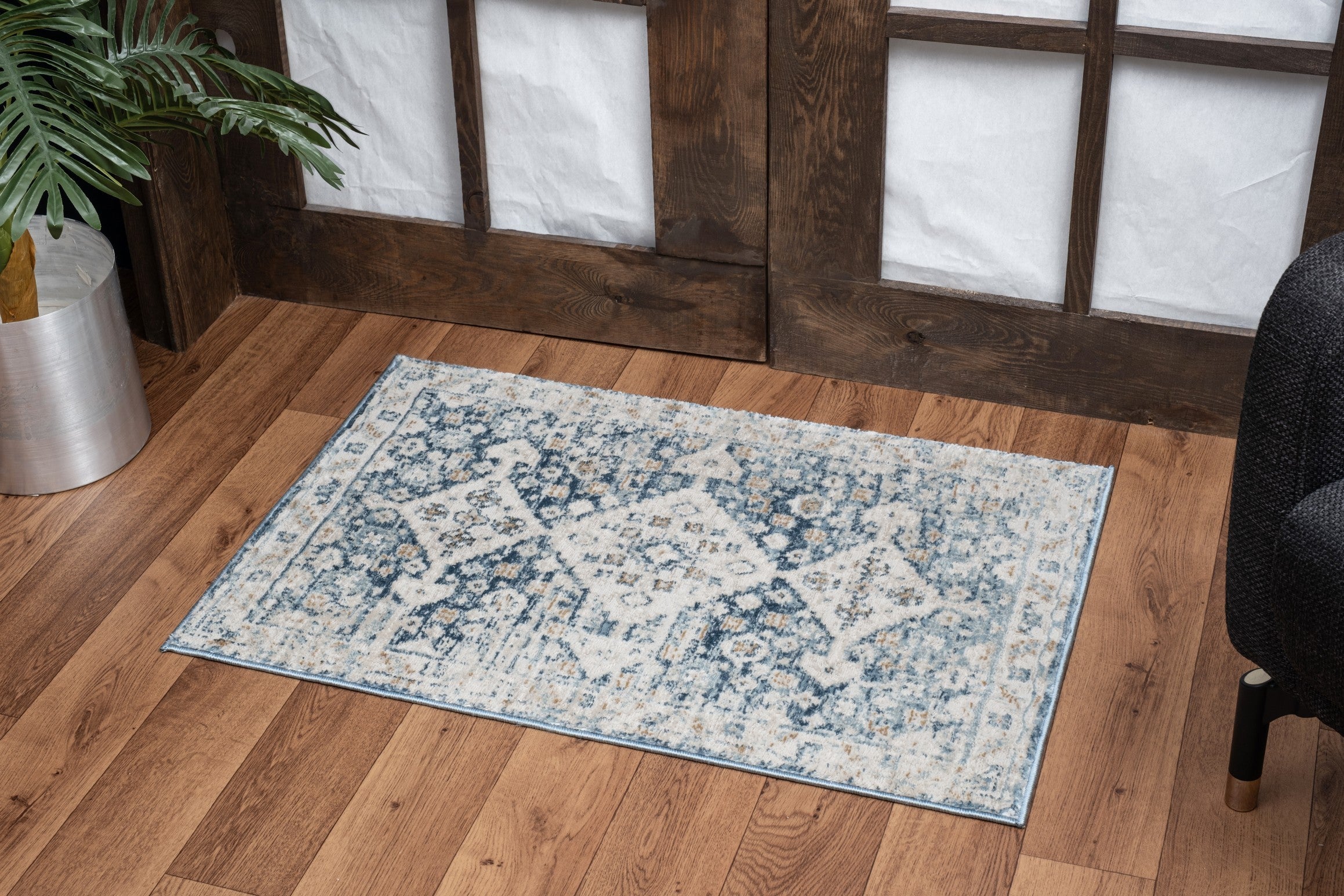 Noble Blue 2 ft. x 3 ft. area rug featuring a navy medallion pattern, made of durable polyester with a jute backing.