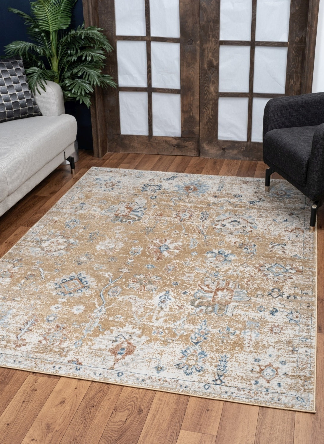 Noble Gold Area Rug measuring 5 ft. 3 in. x 7 ft. 3 in., featuring a luxurious gold color and soft polyester material, perfect for any living space.