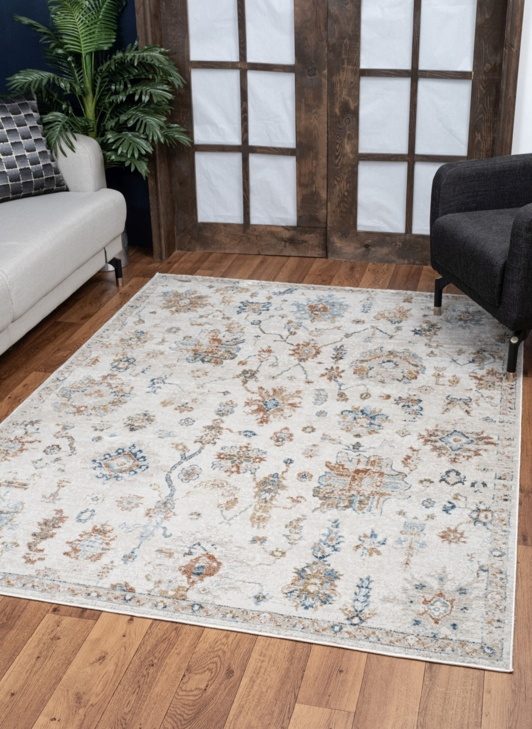 Noble Ivory Area Rug measuring 5 ft. 3 in. x 7 ft. 3 in., featuring a soft polyester texture and elegant ivory color.