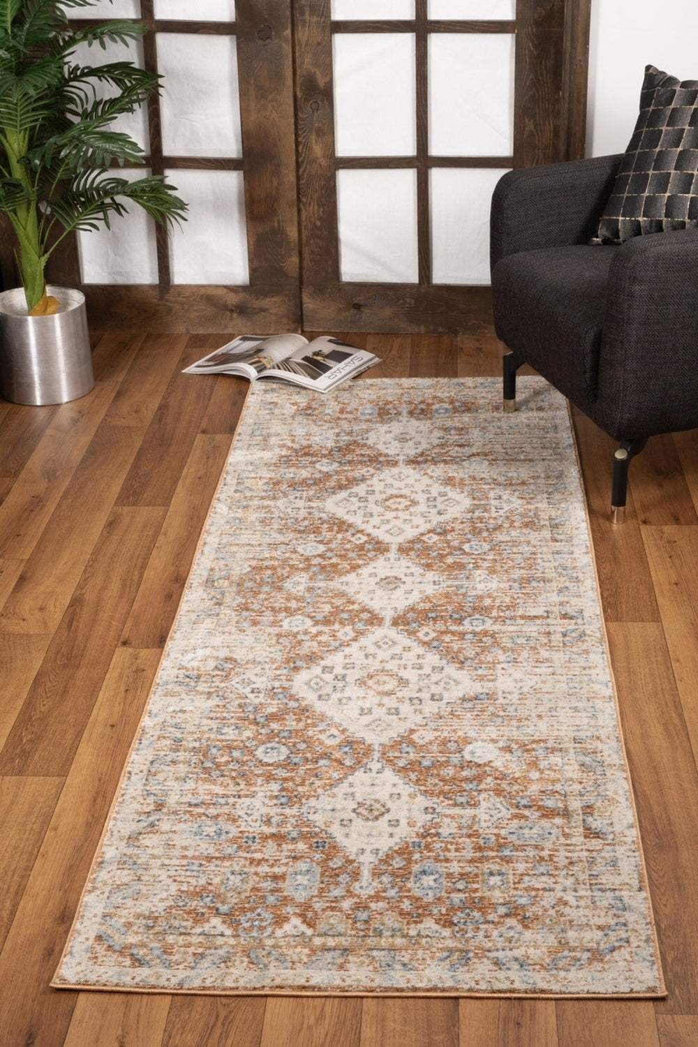 Noble Rust Area Rug measuring 2 ft. 7 in. x 7 ft. 3 in., featuring a rich rust color and intricate medallion patterns, perfect for home decor.