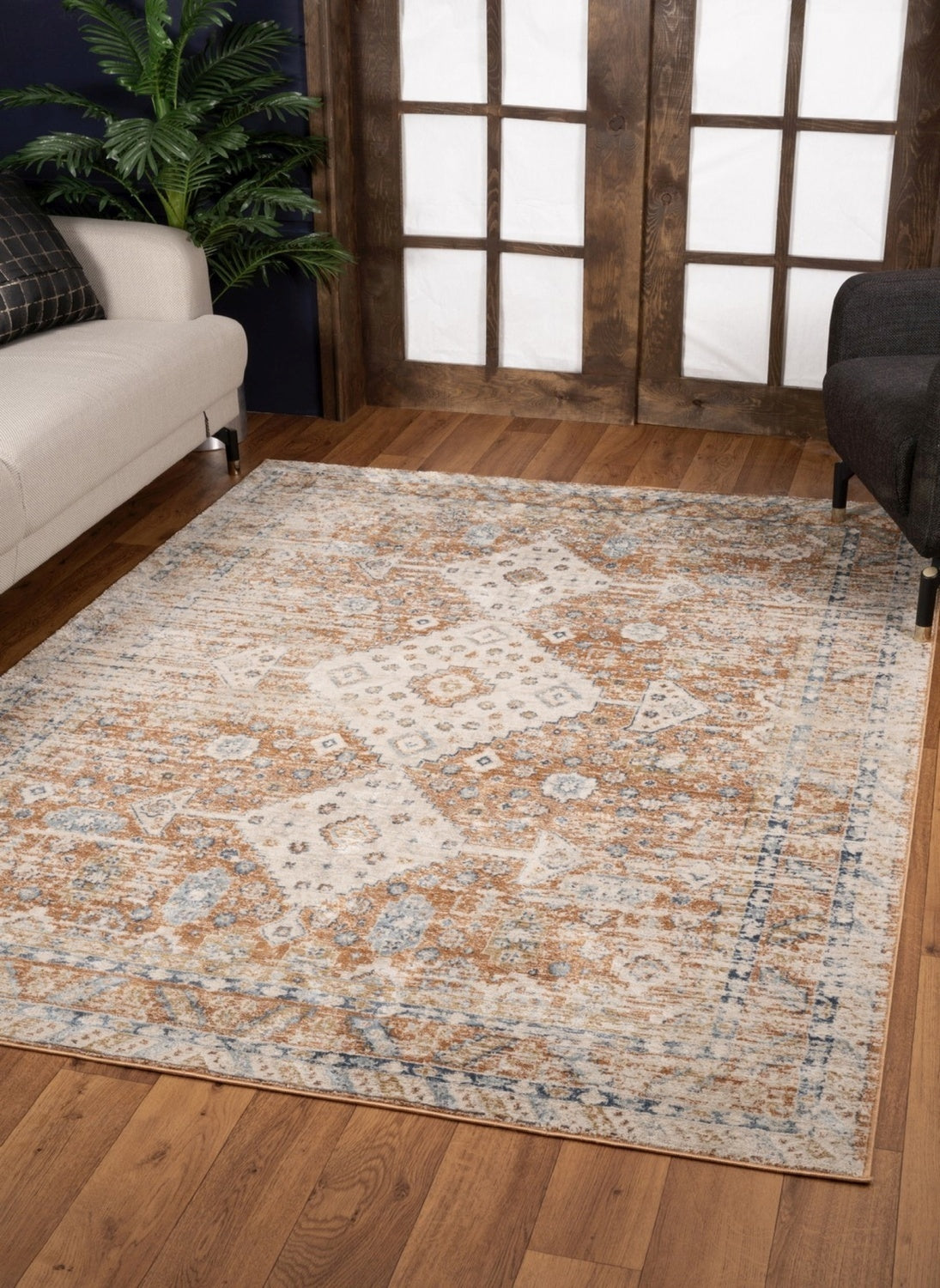 Noble Rust Area Rug measuring 5 ft. 3 in. x 7 ft. 3 in., featuring a rich rust color and intricate medallion patterns, perfect for enhancing home decor.