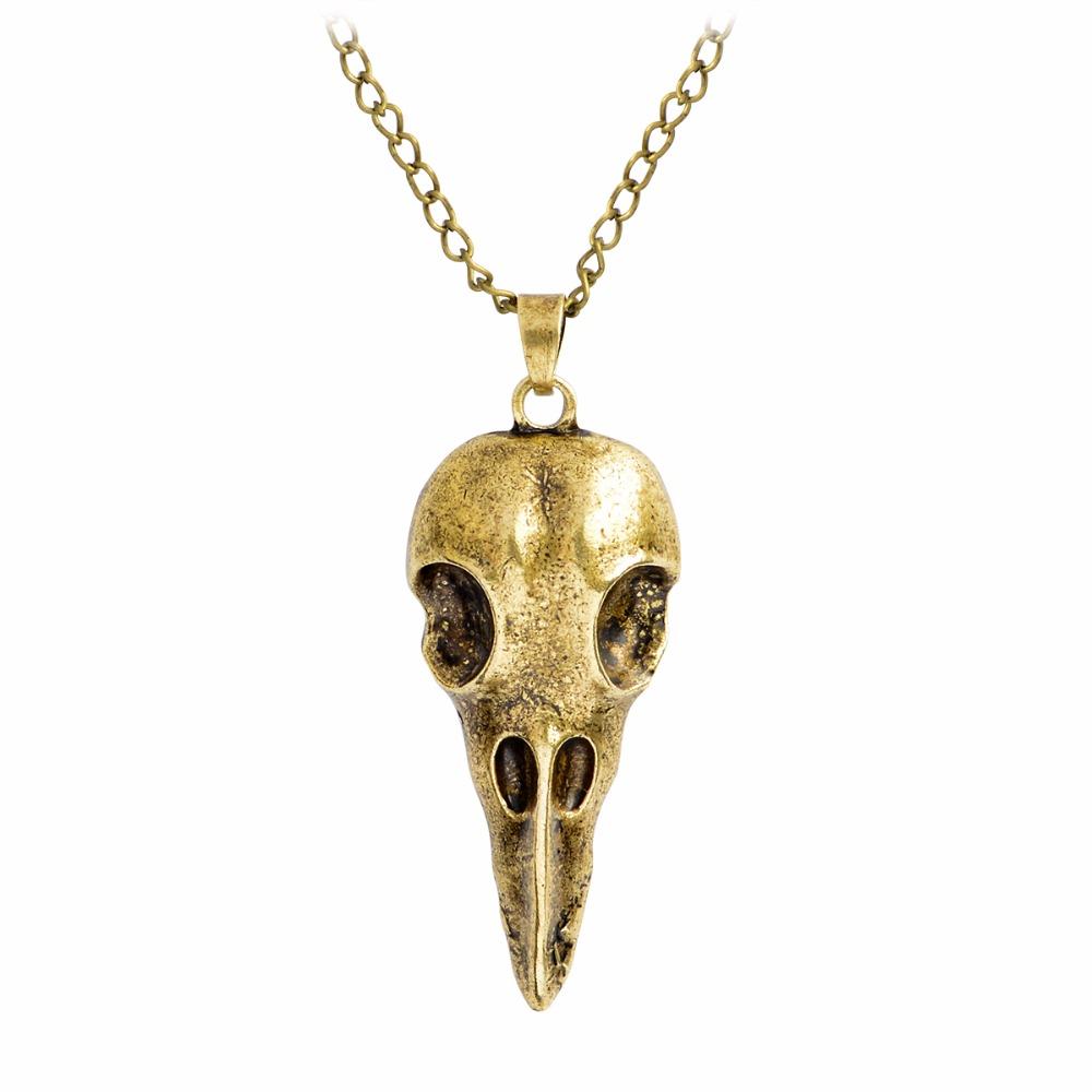 Nordic Viking Raven Skull Pendant Necklace featuring intricate skull design in bronze and silver, hanging from a stylish link chain.