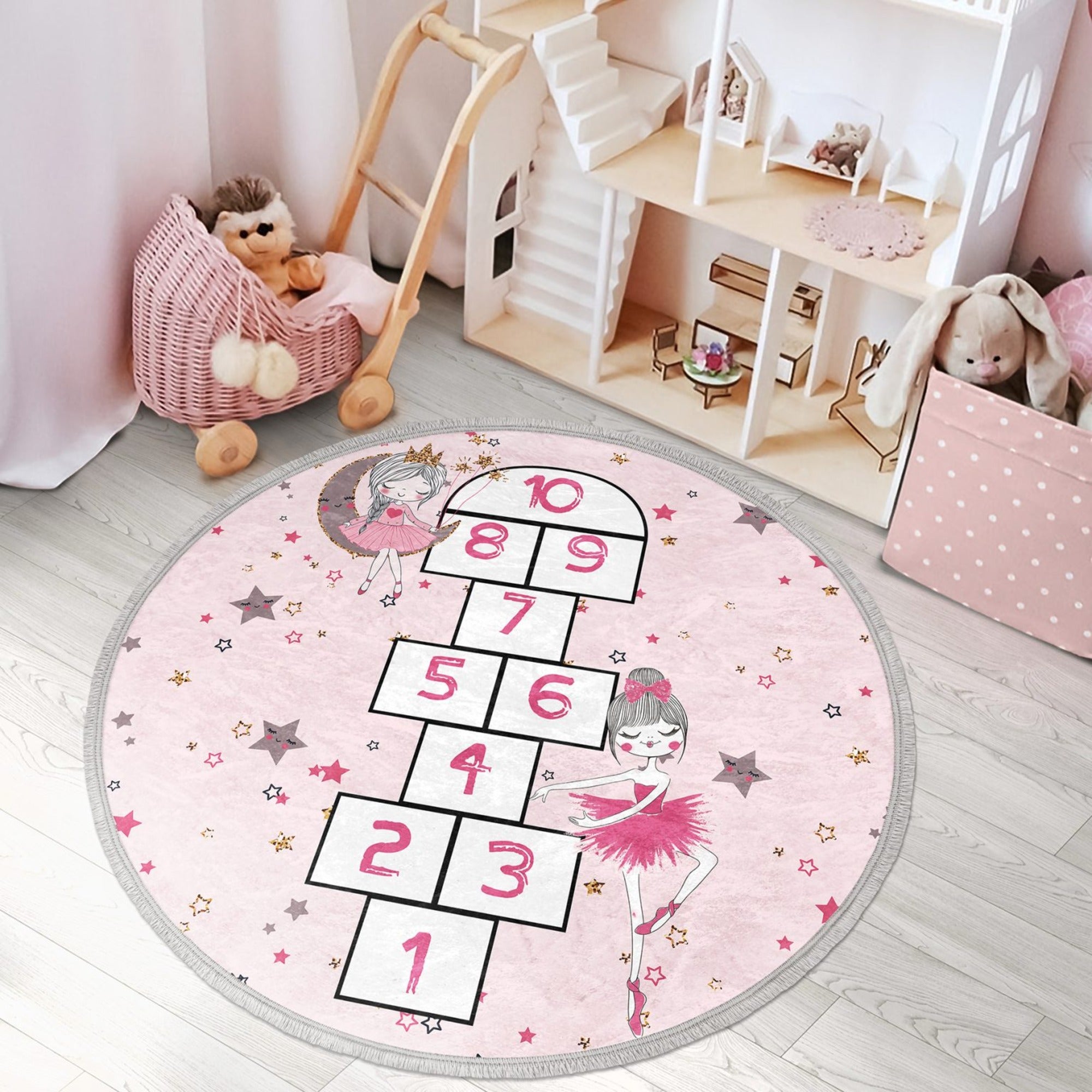 A vibrant pink circle rug featuring playful numbers, perfect for a child's room or nursery, showcasing its soft texture and non-slip backing.