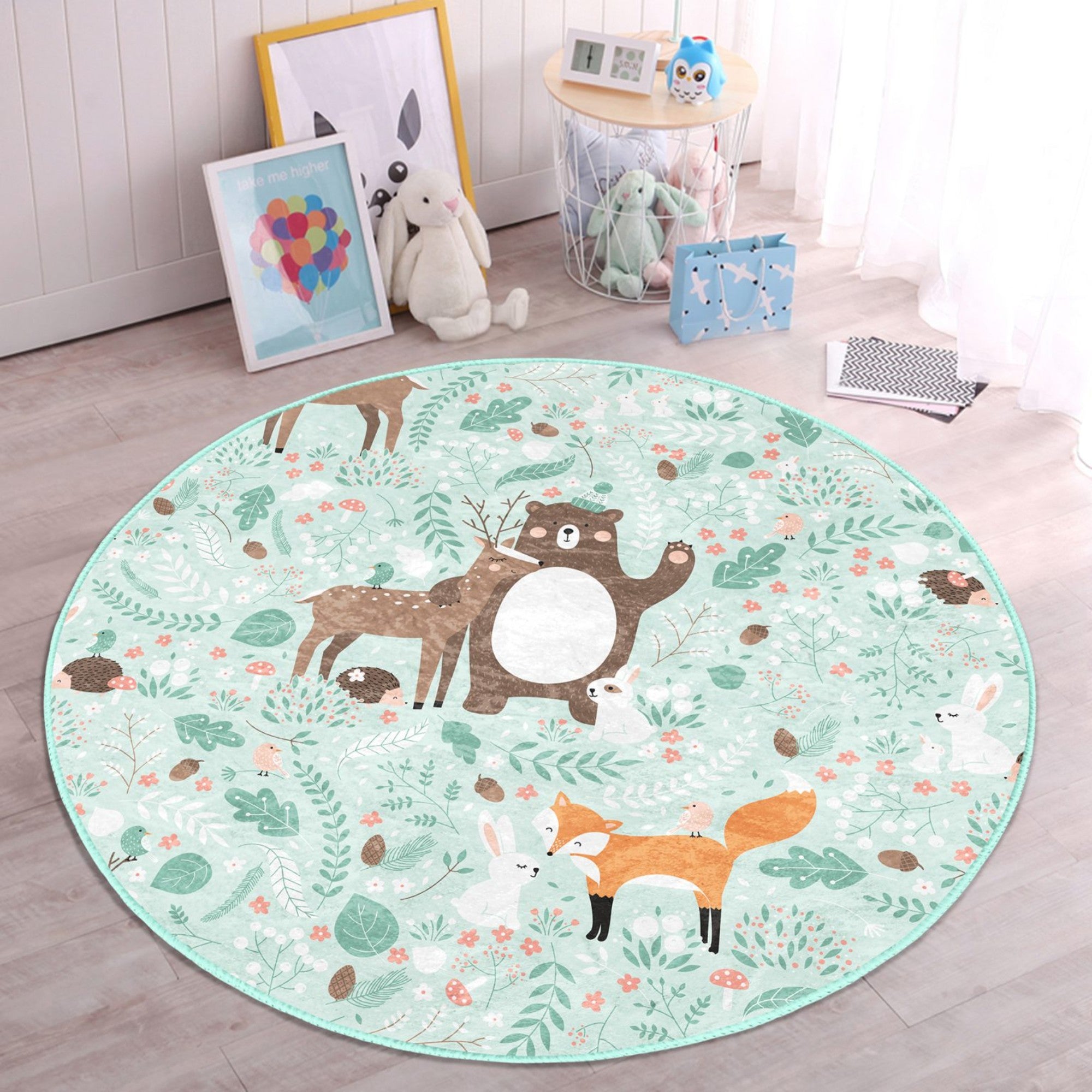 A colorful round rug featuring a decorative animal pattern, perfect for nursery rooms, showcasing vibrant colors and a soft texture.