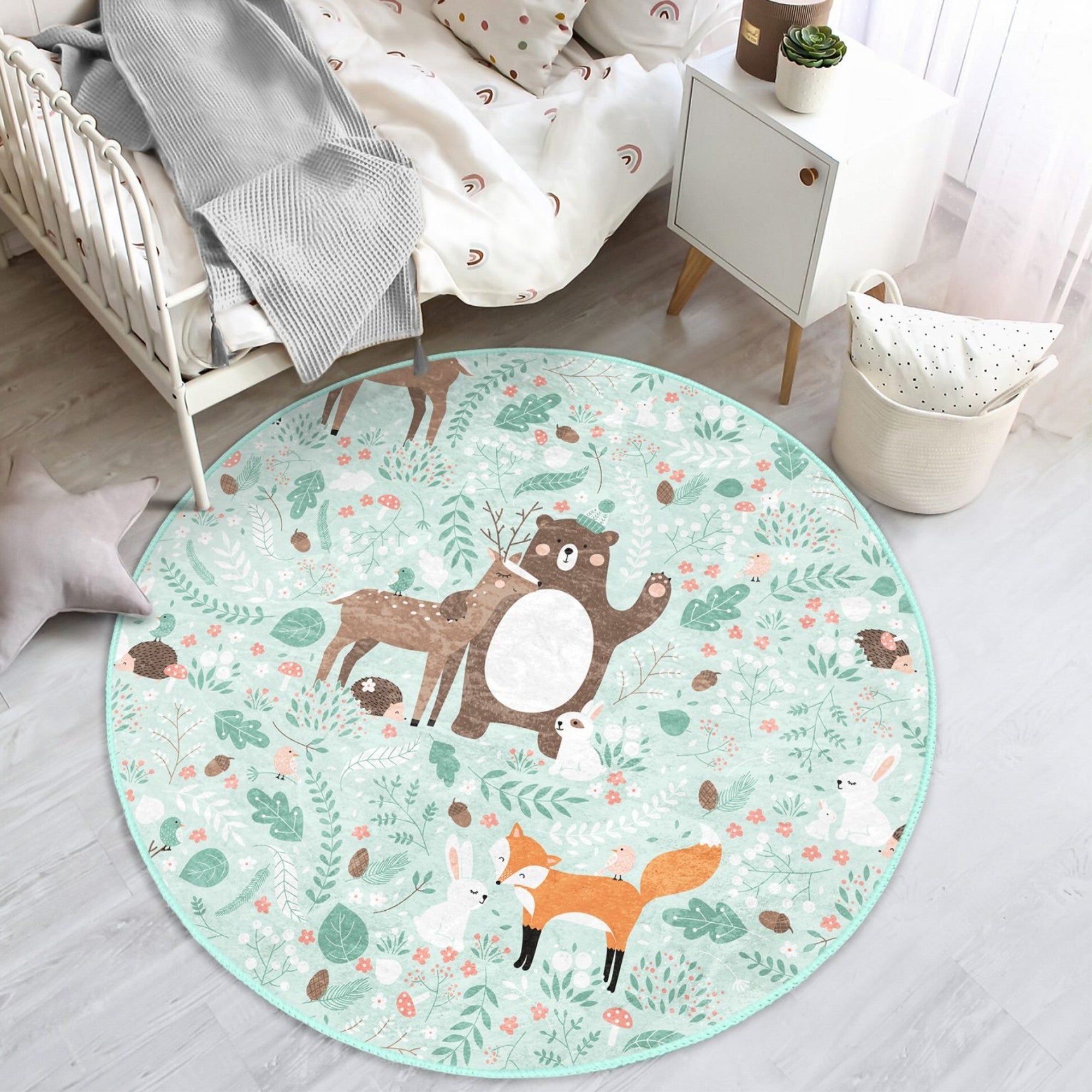 A colorful round rug featuring a decorative animal pattern, perfect for nursery rooms, showcasing vibrant colors and a soft texture.