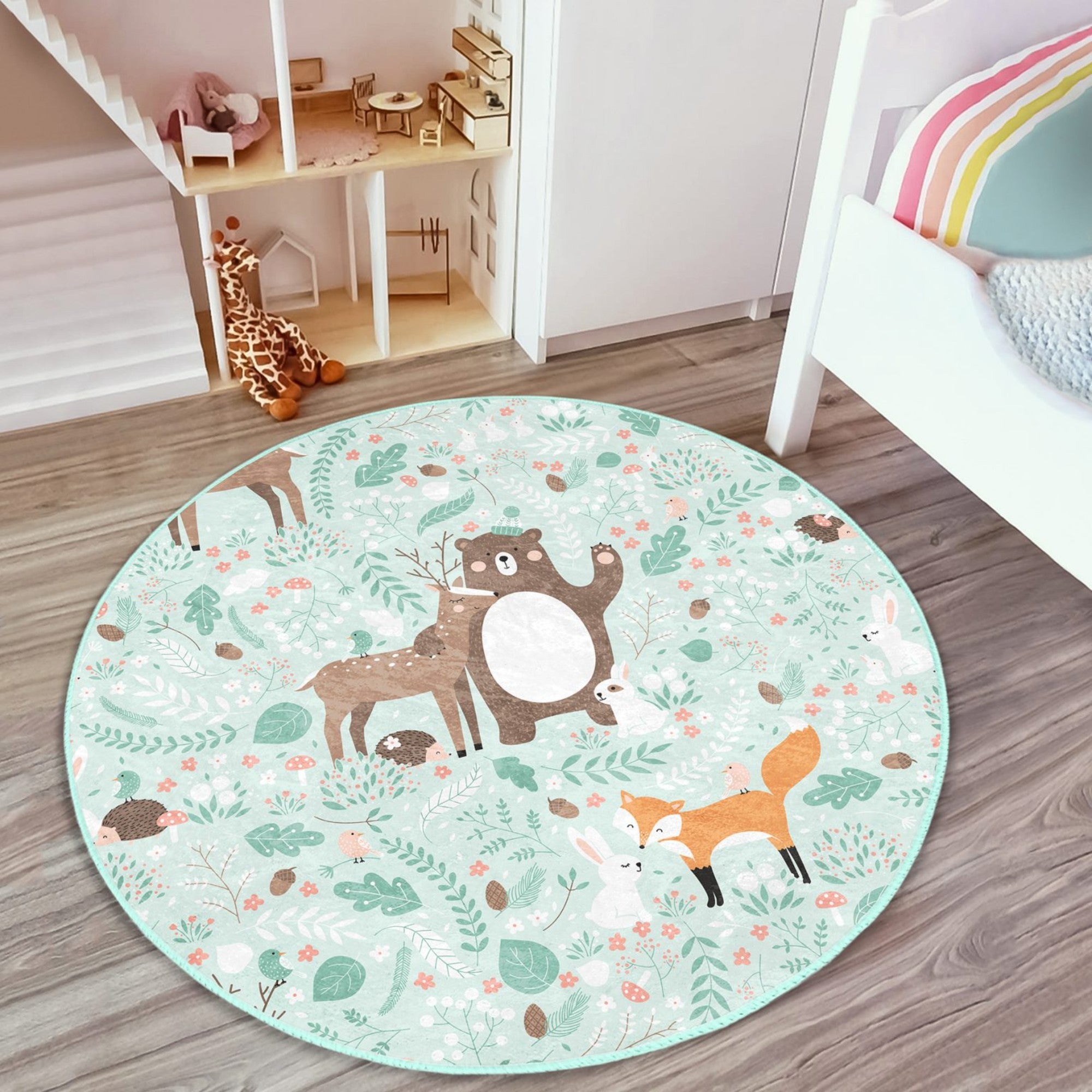 A colorful round rug featuring a decorative animal pattern, perfect for nursery rooms, showcasing vibrant colors and a soft texture.