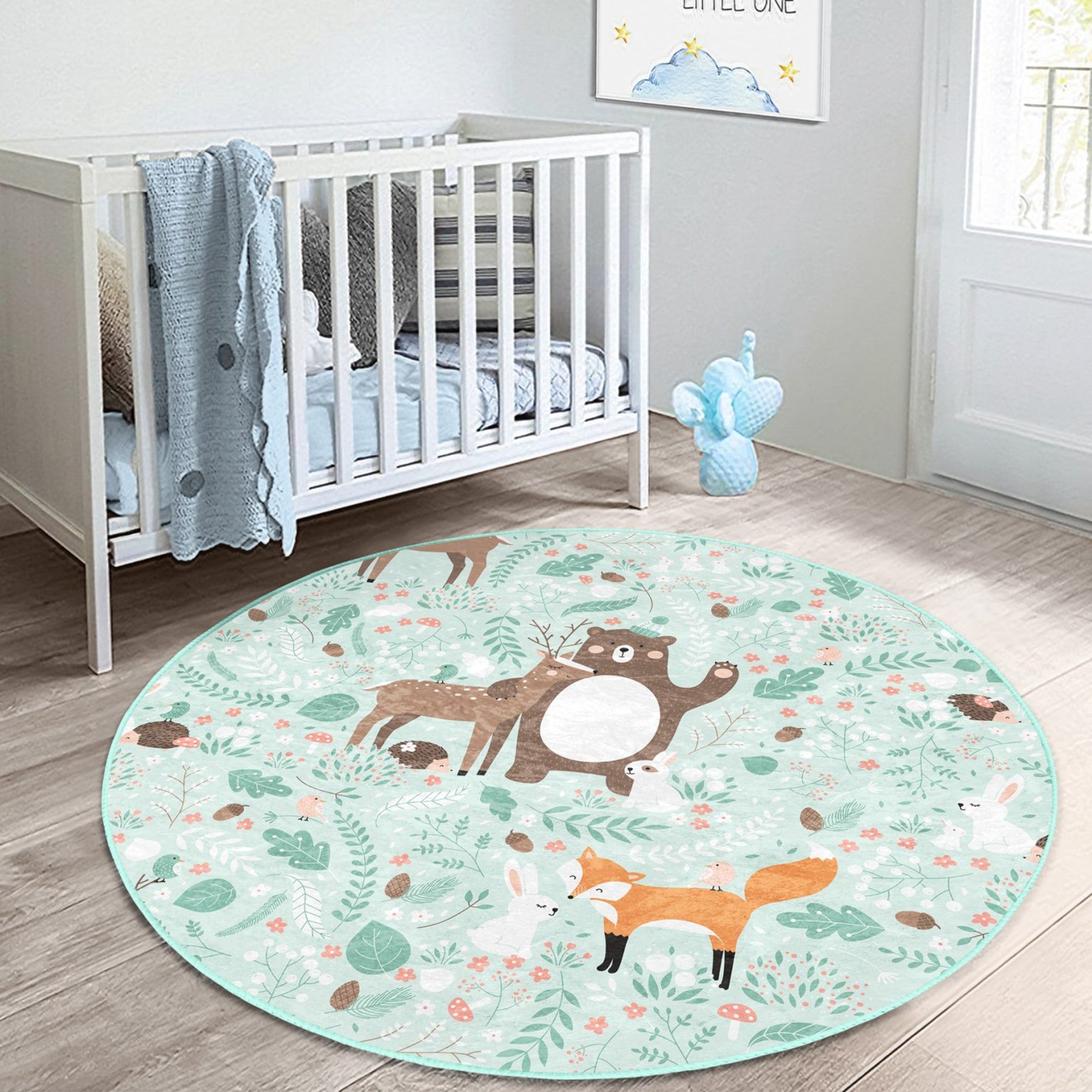 A colorful round rug featuring a decorative animal pattern, perfect for nursery rooms, showcasing vibrant colors and a soft texture.