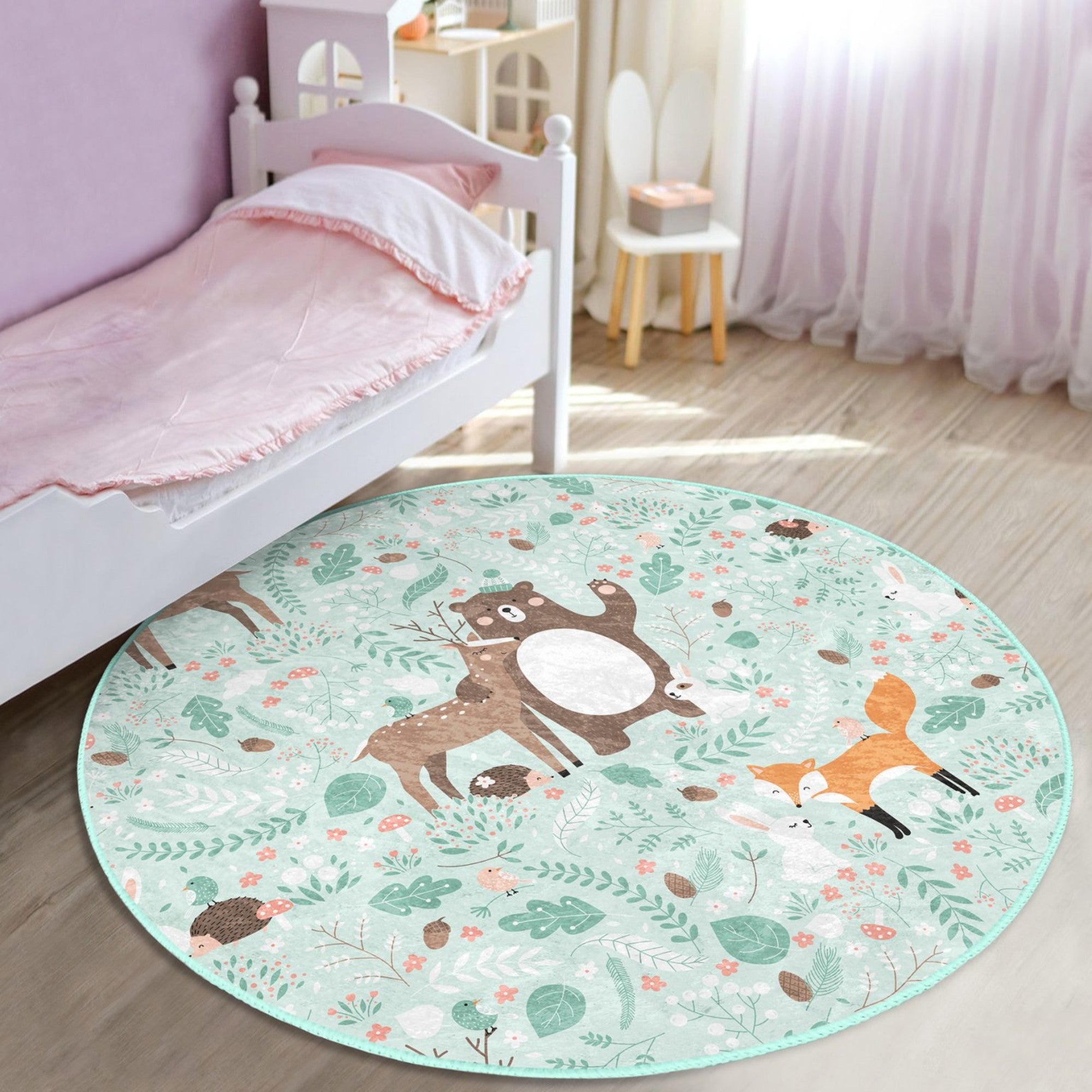 A colorful round rug featuring a decorative animal pattern, perfect for nursery rooms, showcasing vibrant colors and a soft texture.