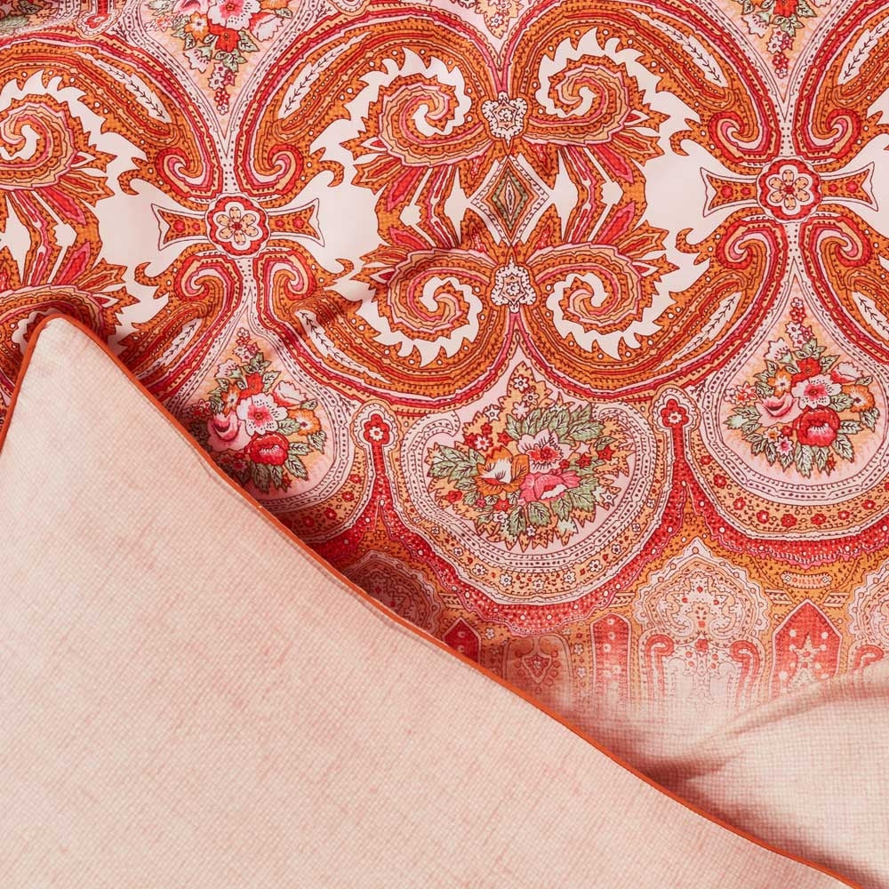 Oilily Paisley Pink Quilt Cover Set King featuring vibrant paisley patterns in pink, red, orange, and green on soft cotton sateen fabric.