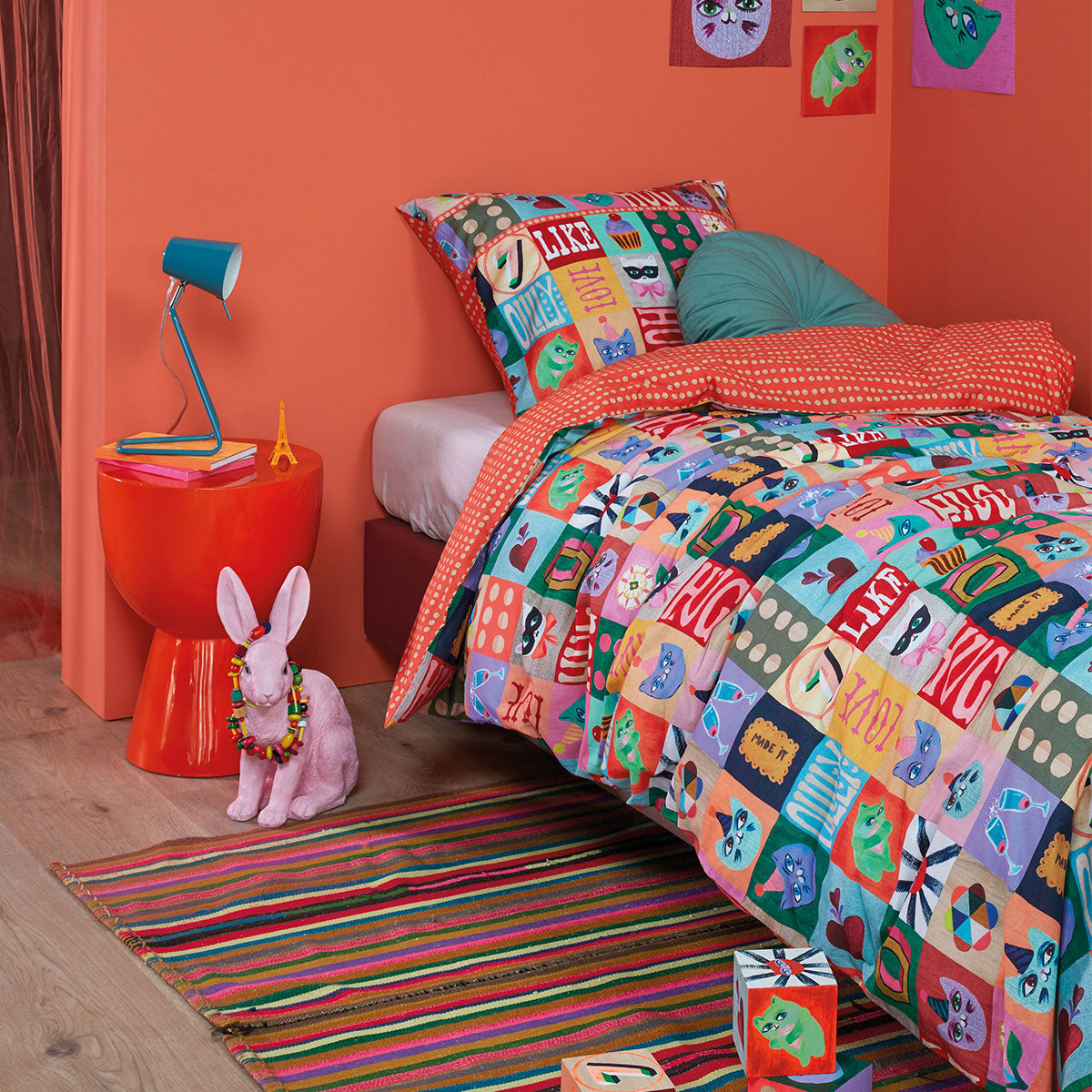 Oilily Party Blocks Cotton Quilt Cover Set Single featuring colorful block designs and bright orange dots on the reverse side.